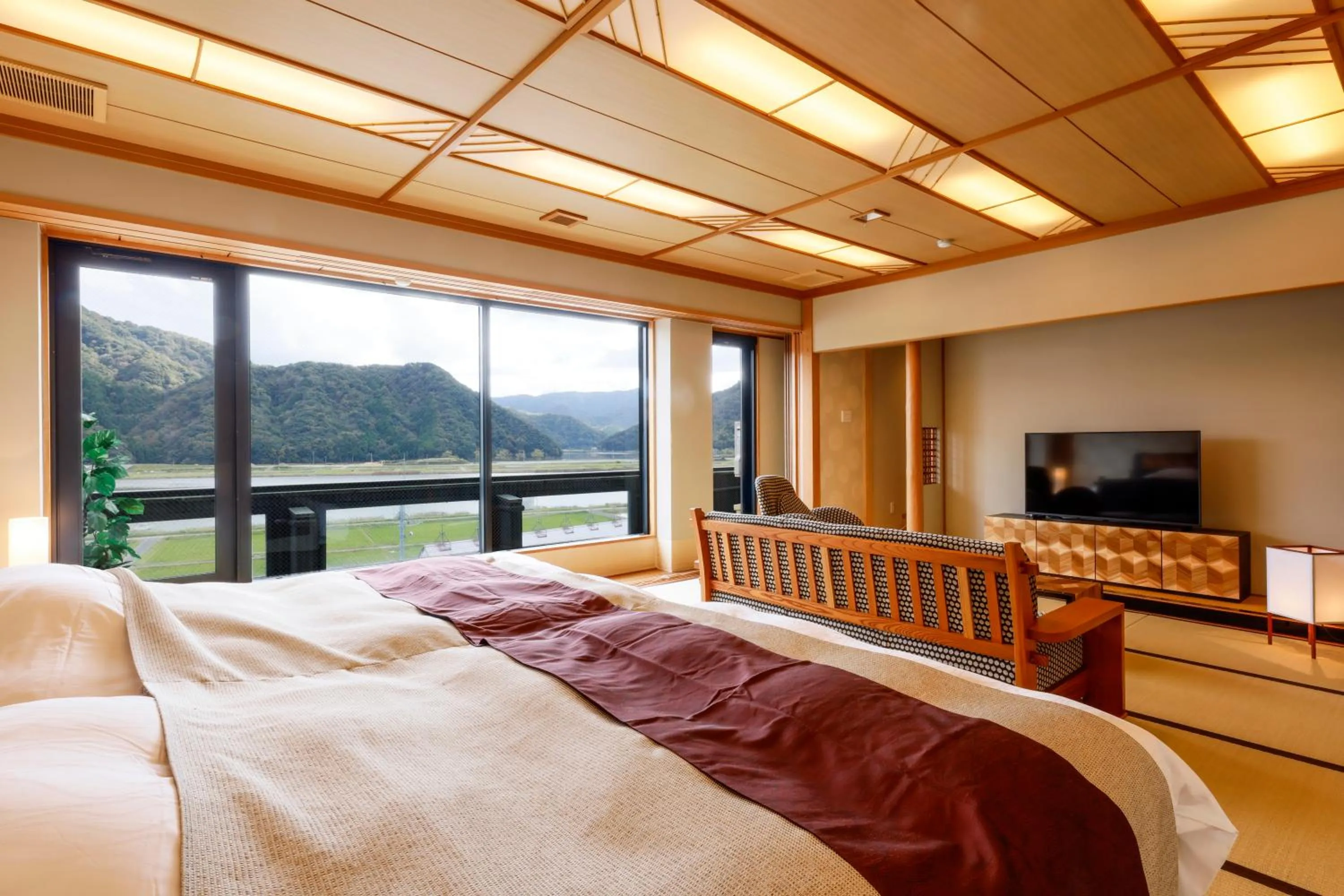 Bed in Kawaguchiya Kinosaki Riverside Hotel