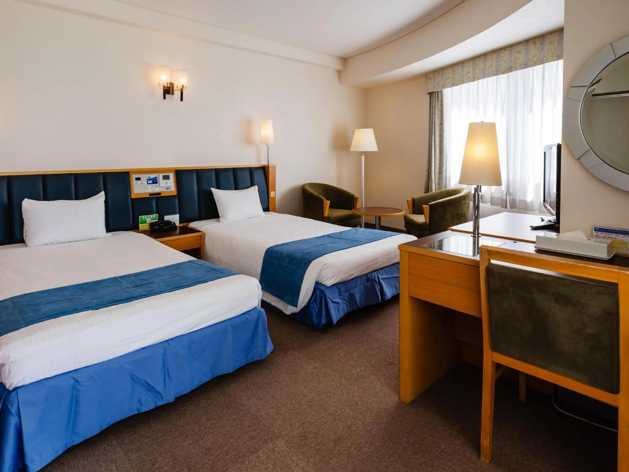 Bed in Hotel Resonex Nago