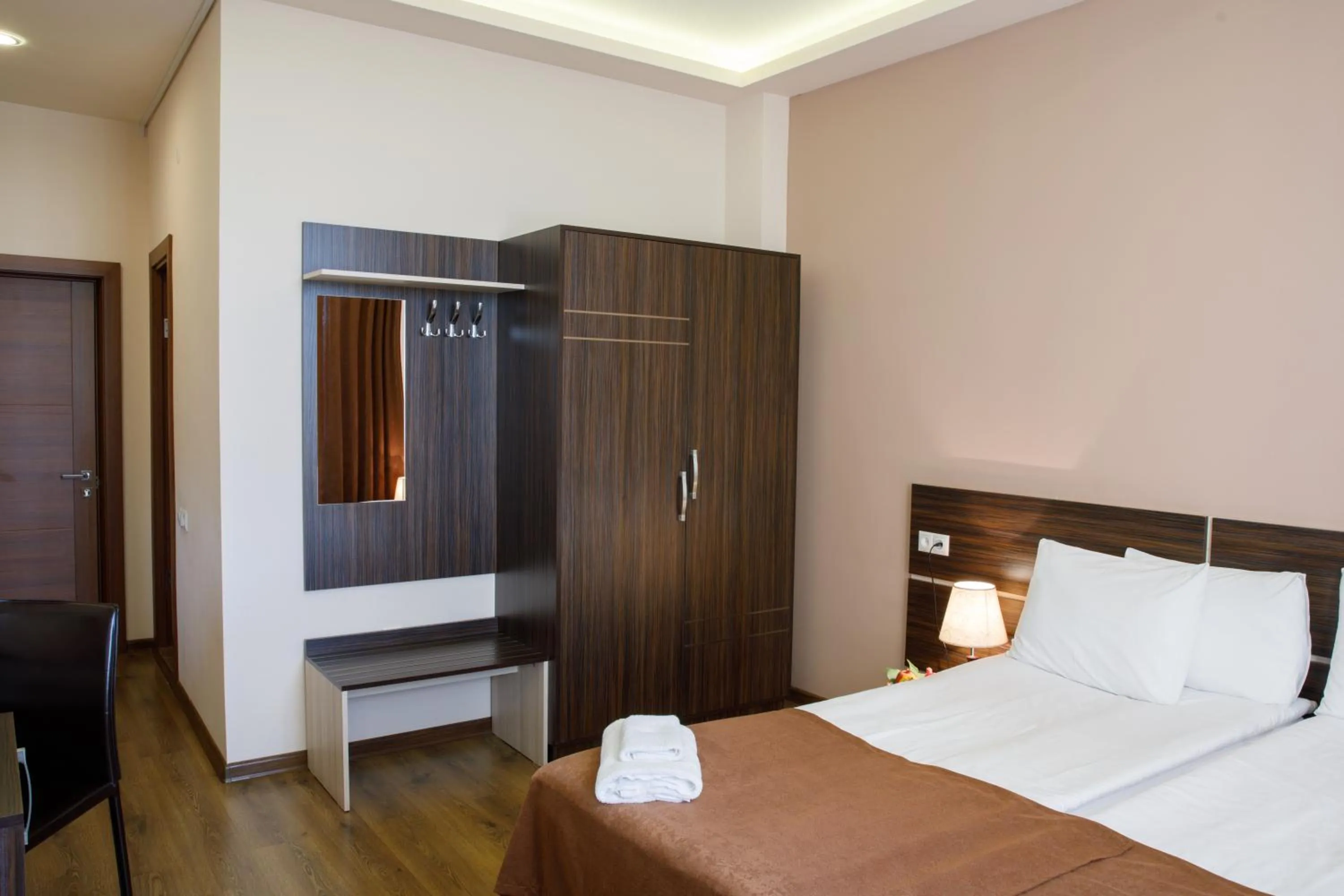 Bed in Olympia Garden Hotel