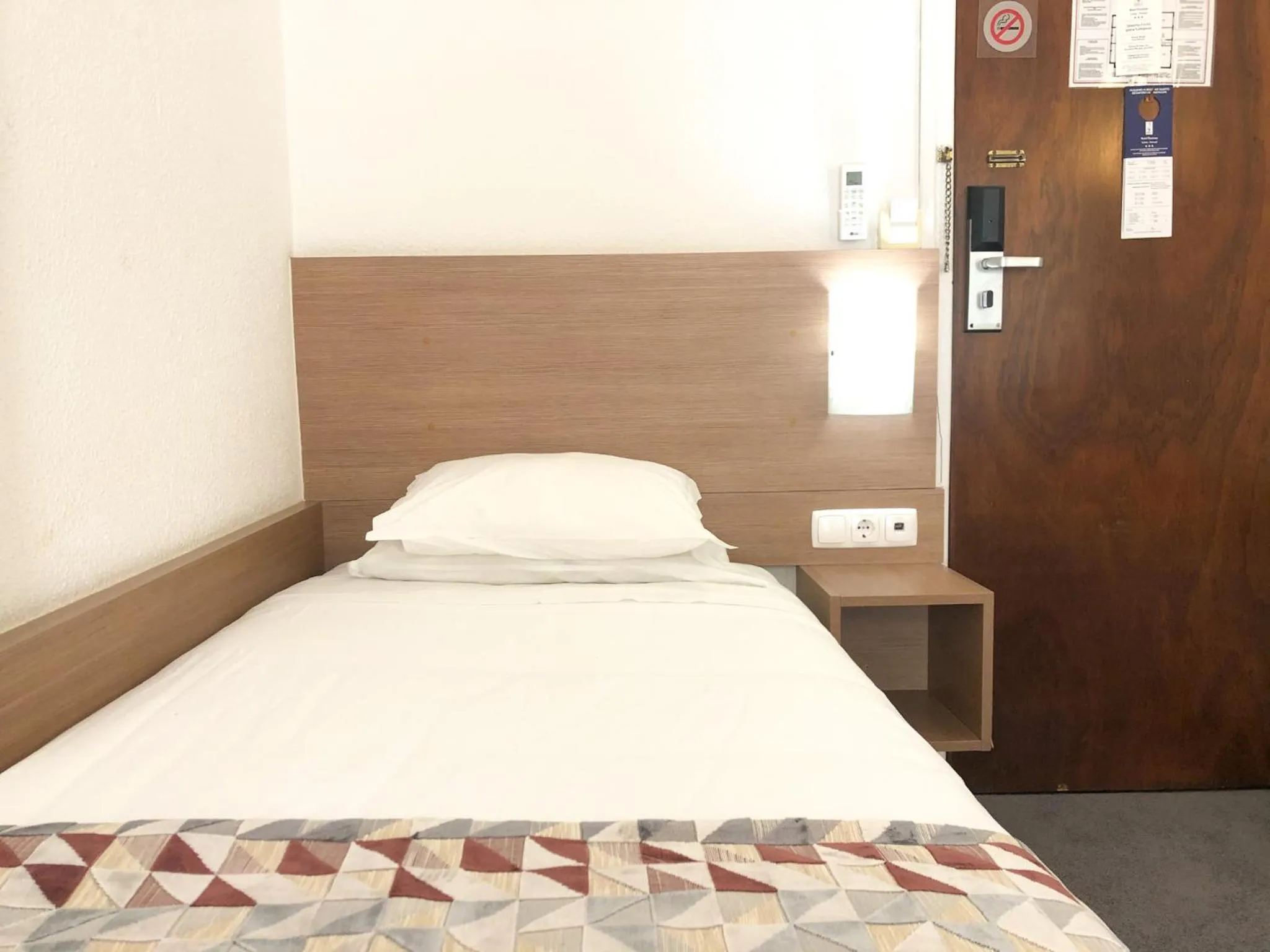 Bed in Hotel Flamingo