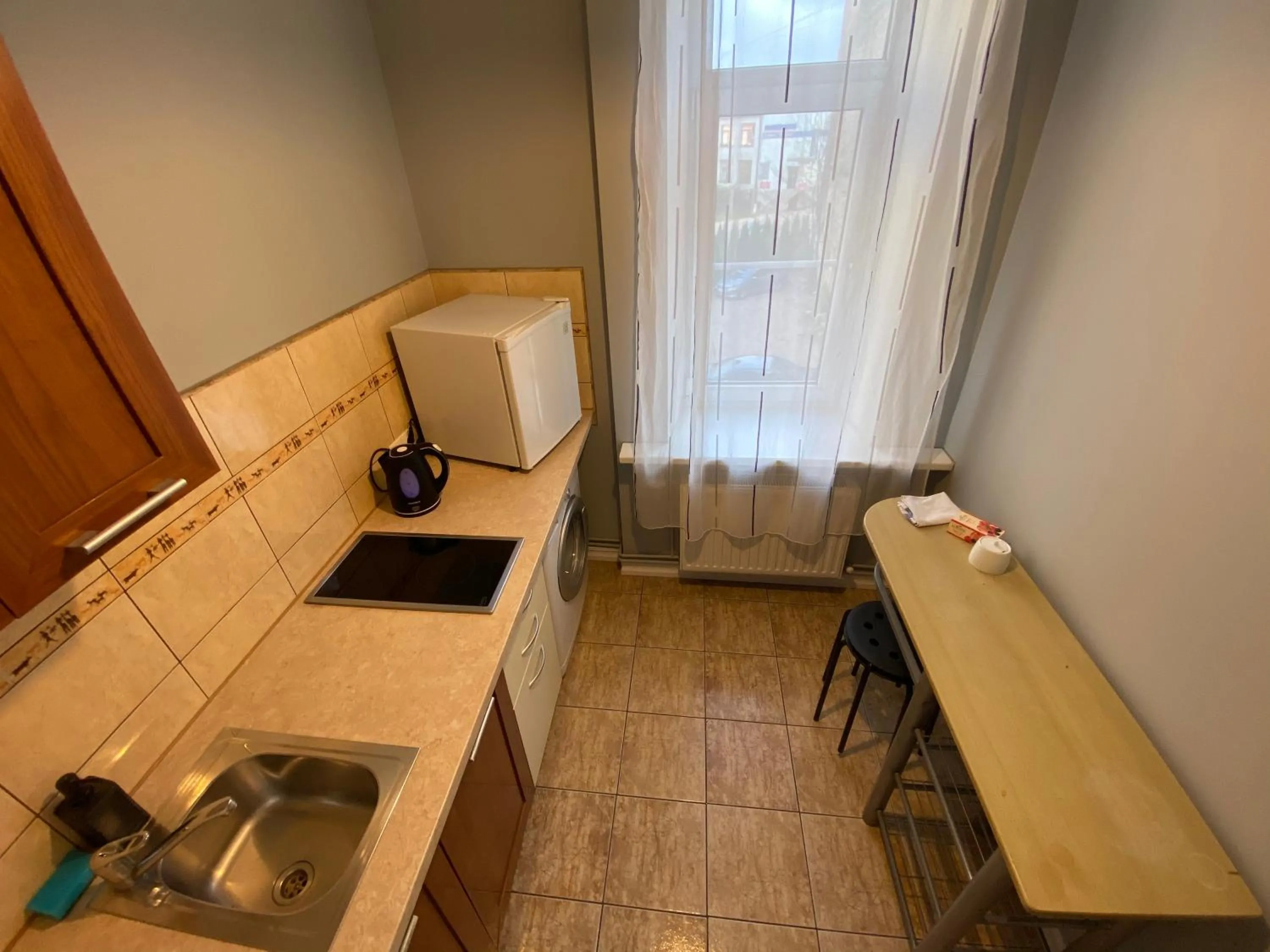 Kitchen or kitchenette in ApartHotel Riga