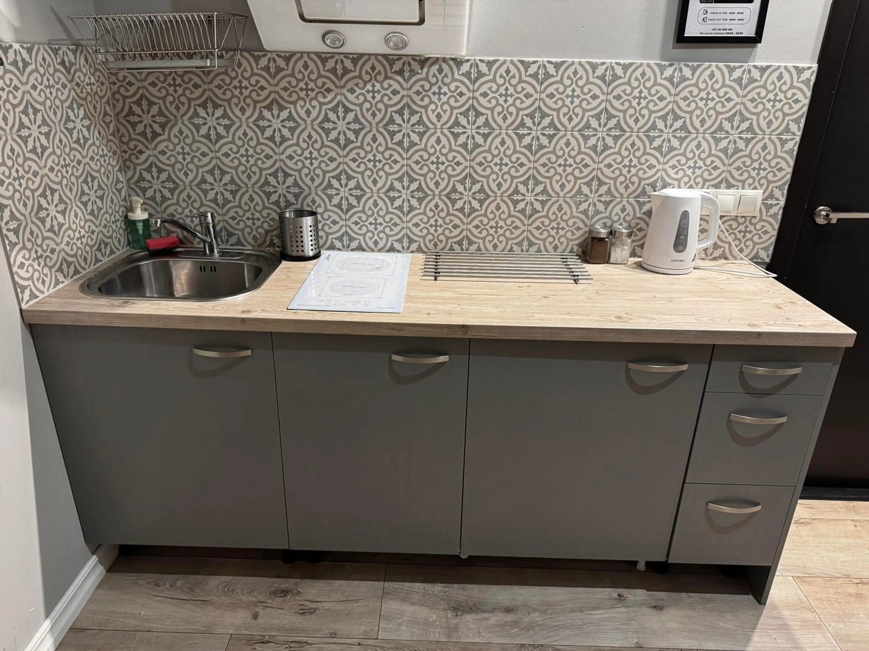 Kitchen or kitchenette in ApartHotel Riga