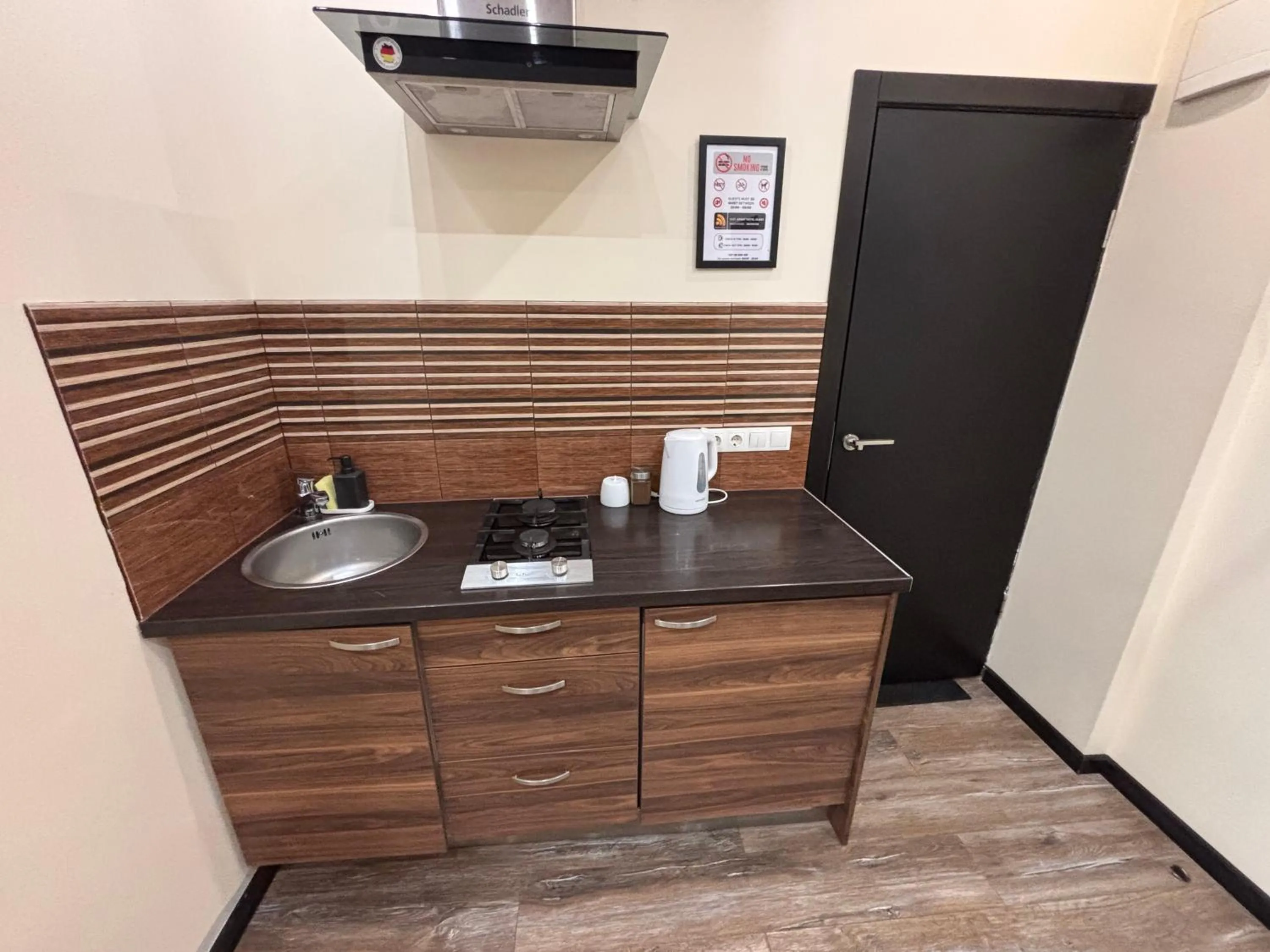 Kitchen or kitchenette in ApartHotel Riga