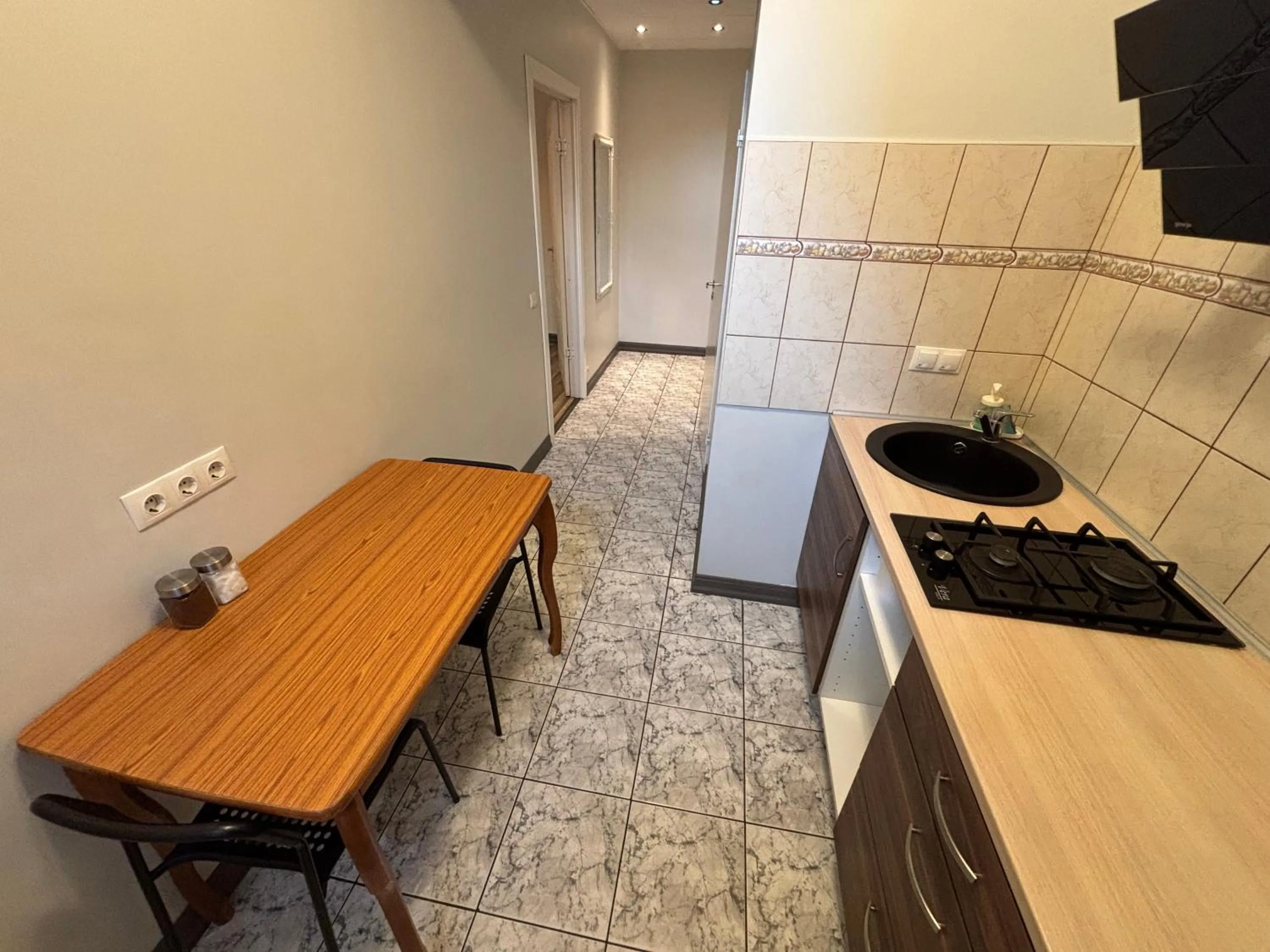 Kitchen or kitchenette in ApartHotel Riga