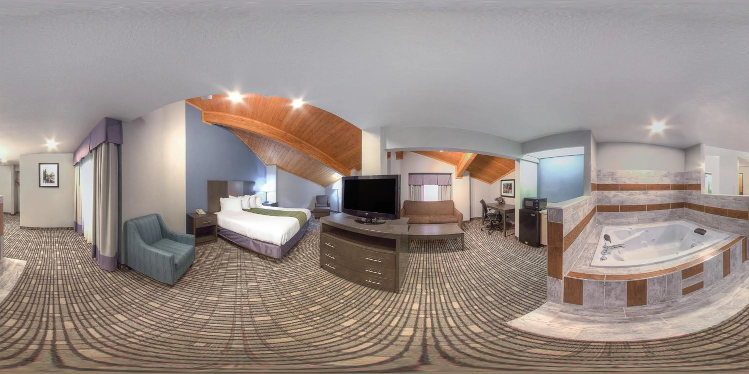 Living room in Baymont by Wyndham Pella