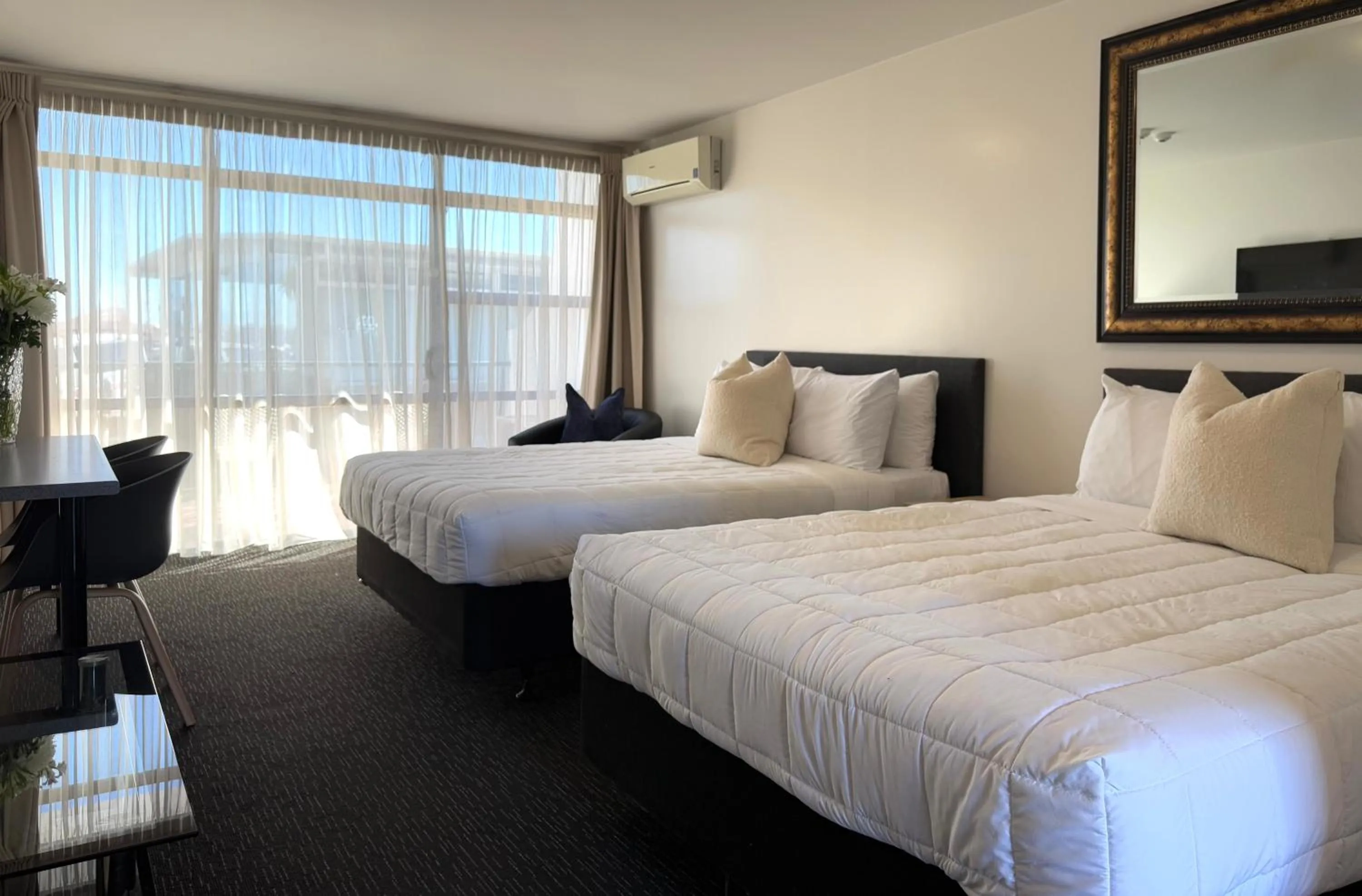 Bed in Bluewater Hotel