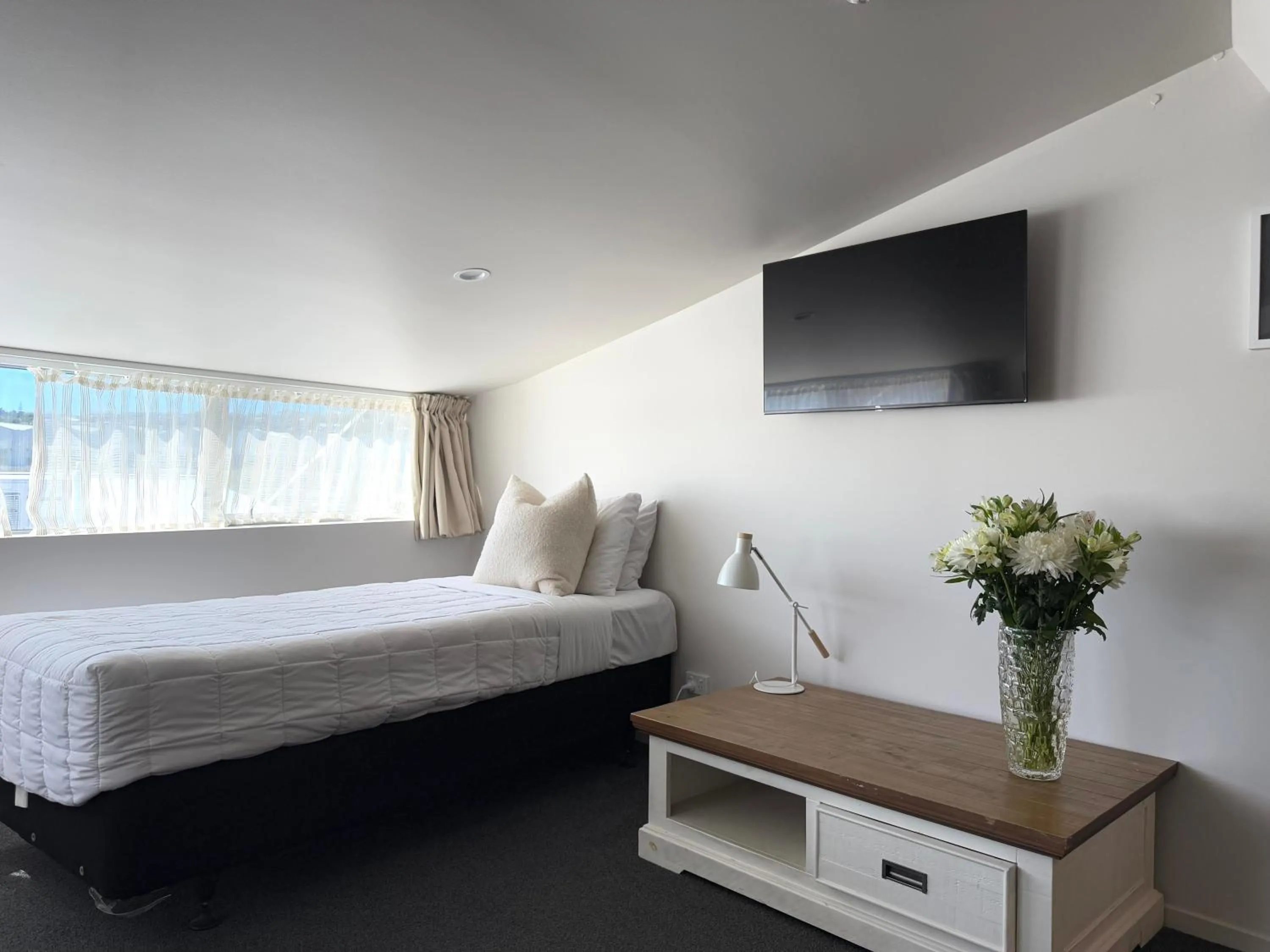 Bed in Bluewater Hotel