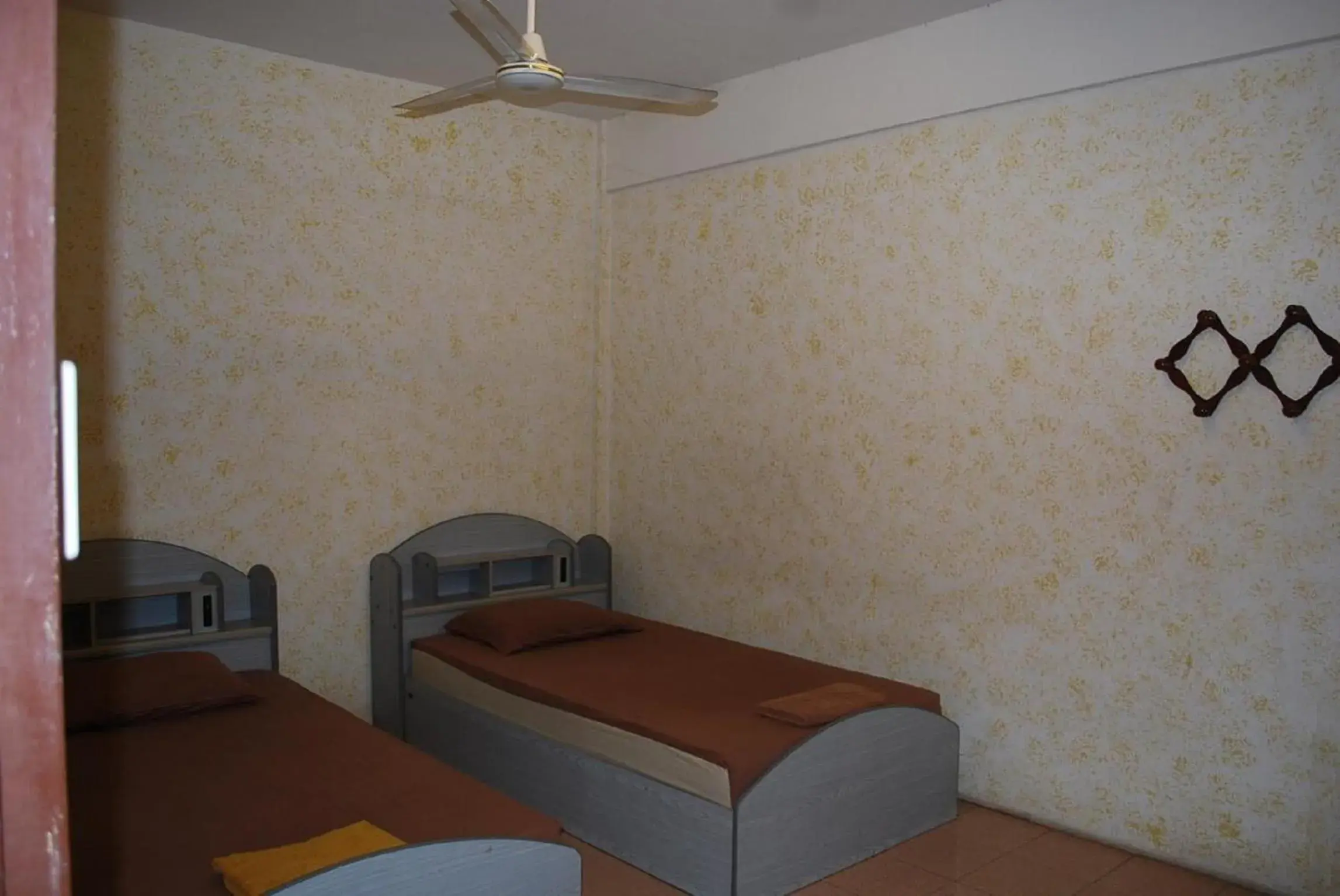 Twin Room with Fan and Shared Bathroom in JP hometel Twin Room with Fan and Shared Bathroom in JP hometel