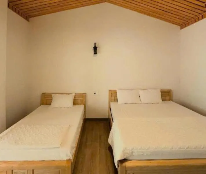Bed in Catba Oasis Bungalows