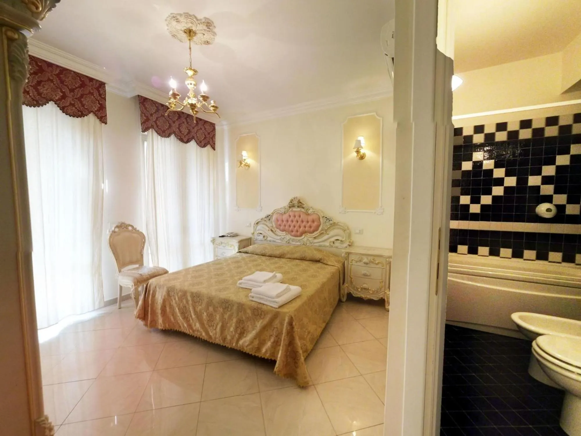 Bed in Colosseo Rooms Imperial Rome