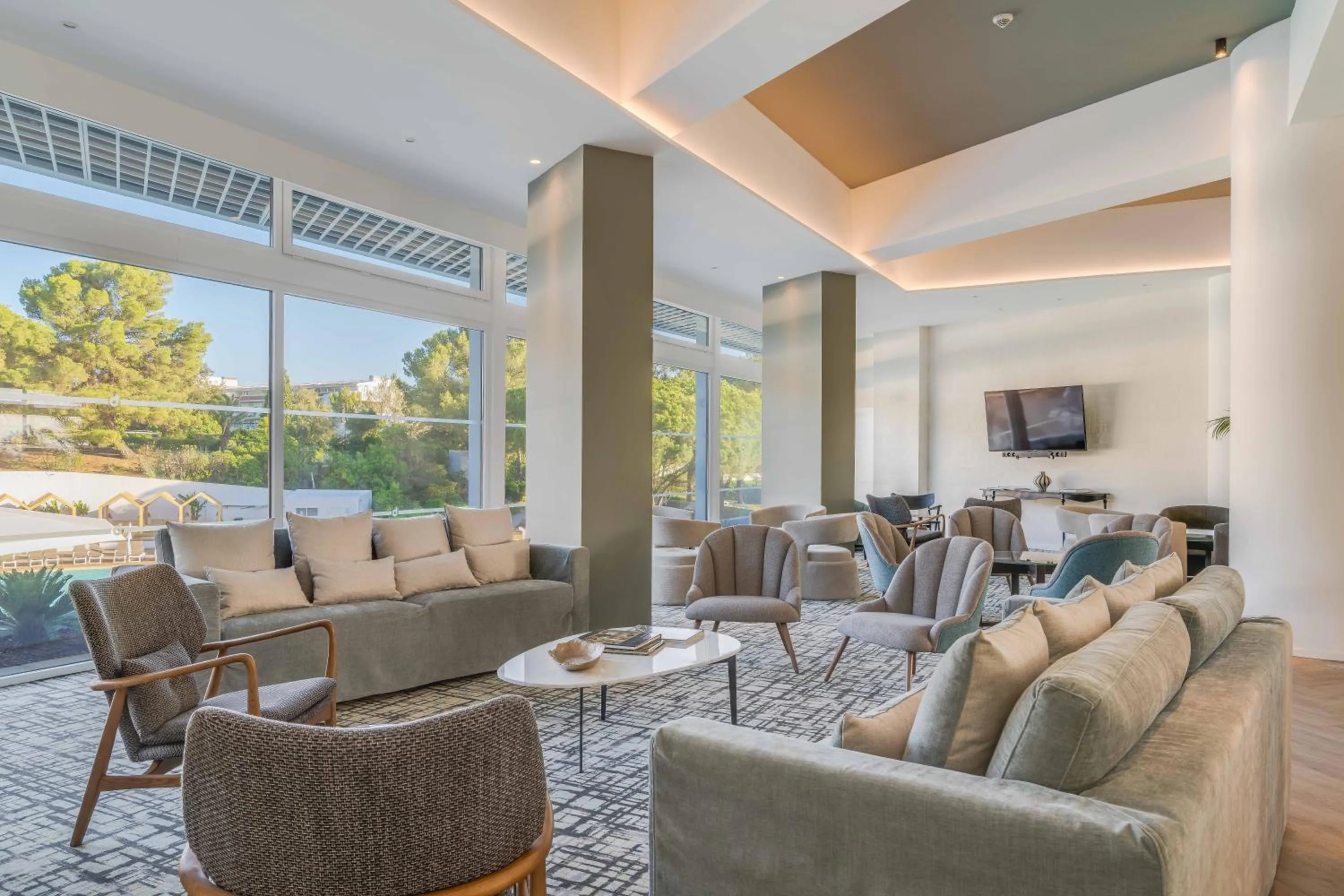 Communal lounge/ TV room in Pestana Blue Alvor Beach - All Inclusive Hotel