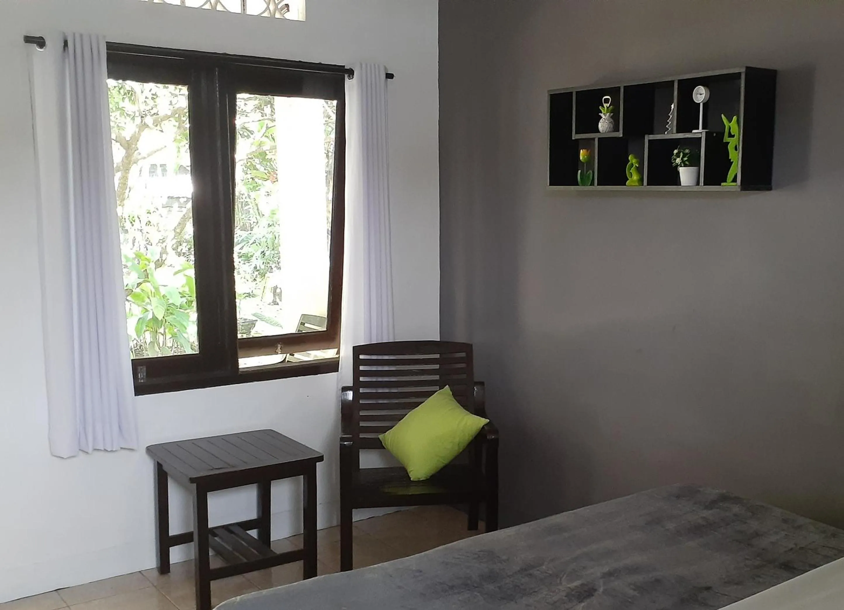 Seating area, Bed in Indah Homestay and Cooking classes