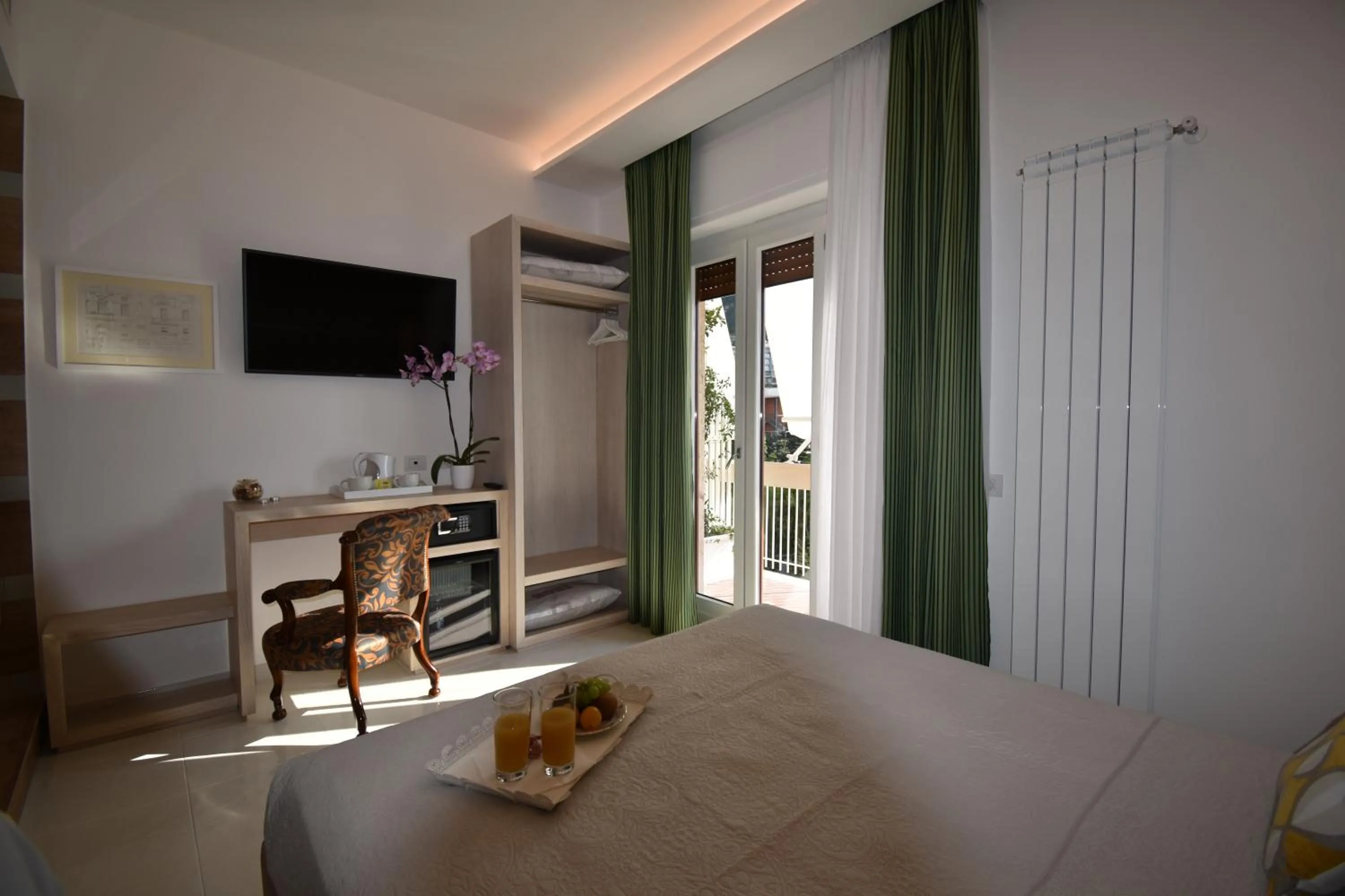 Photo of the whole room, Bed in Melody Sorrento Suites