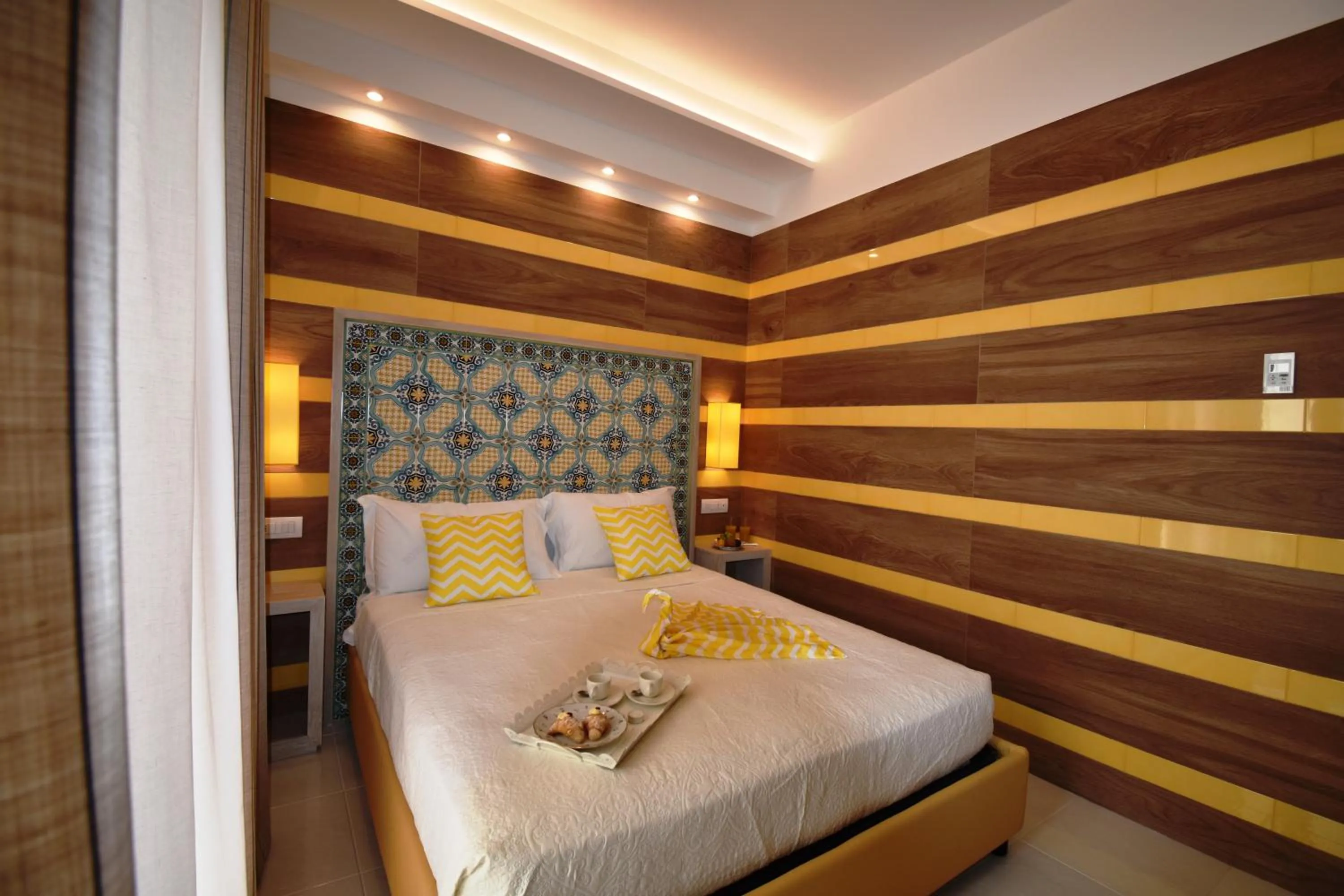 Photo of the whole room, Bed in Melody Sorrento Suites