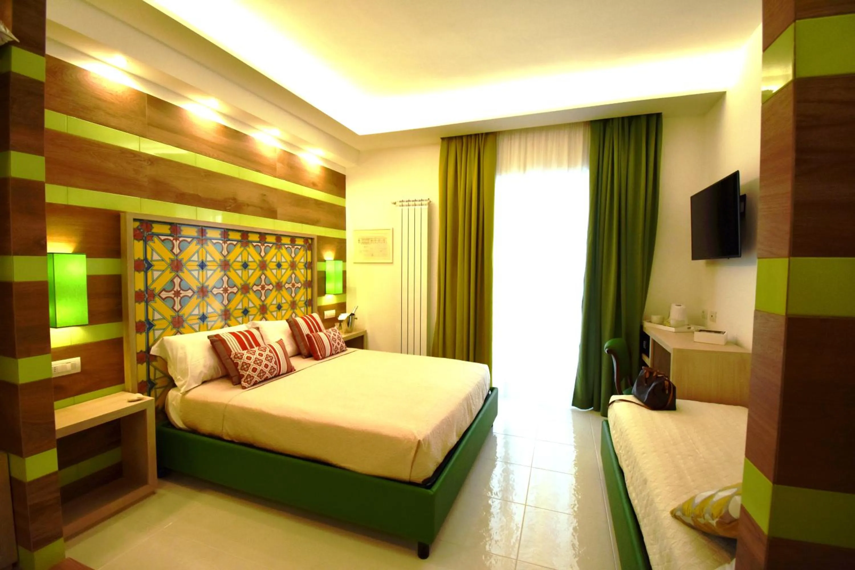 Photo of the whole room, Bed in Melody Sorrento Suites