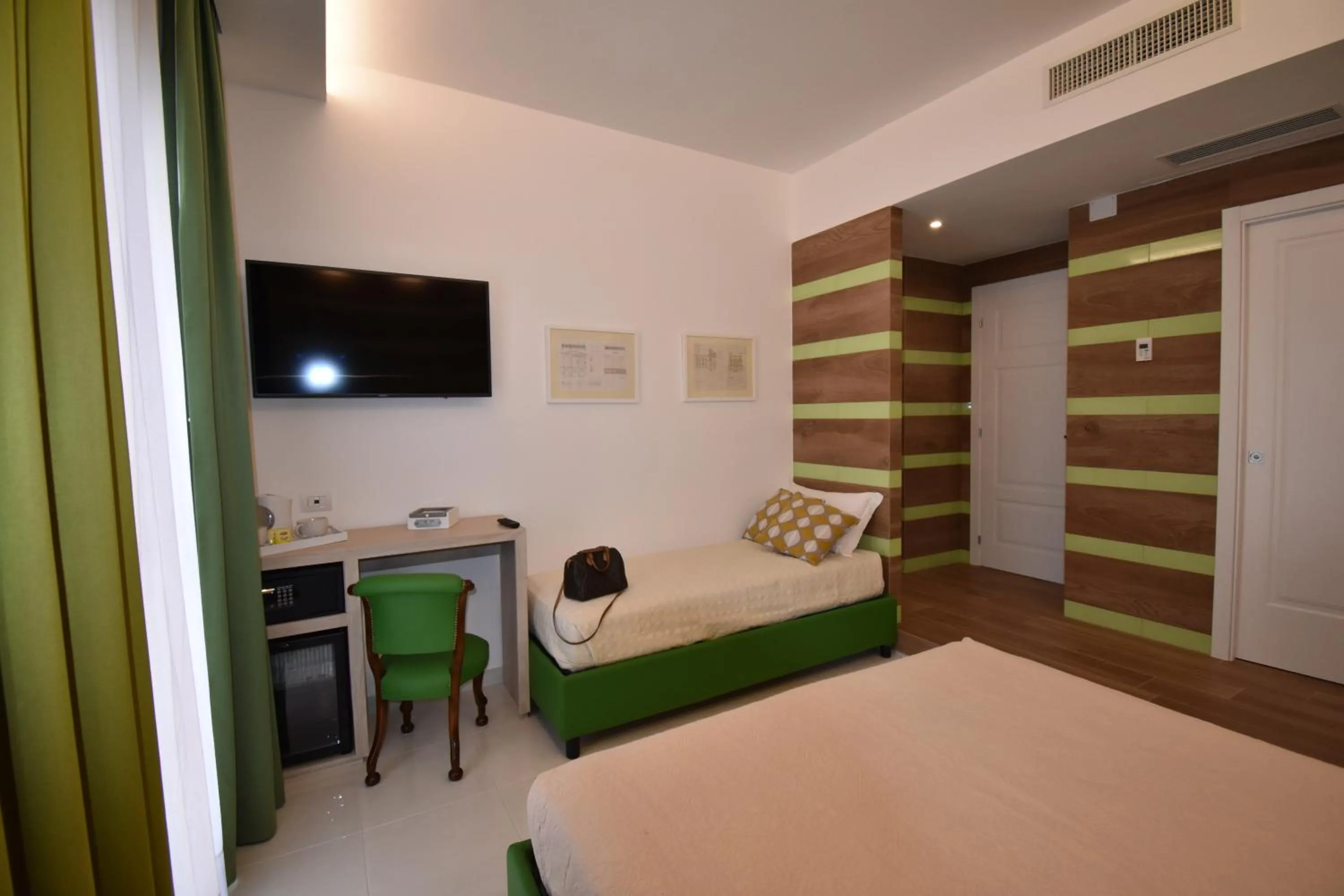 Photo of the whole room, Bed in Melody Sorrento Suites