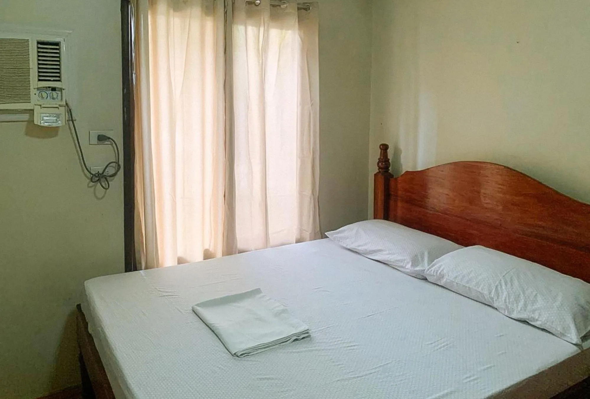 Bed in UrbanView BNKY Bed and Breakfast Palawan by RedDoorz