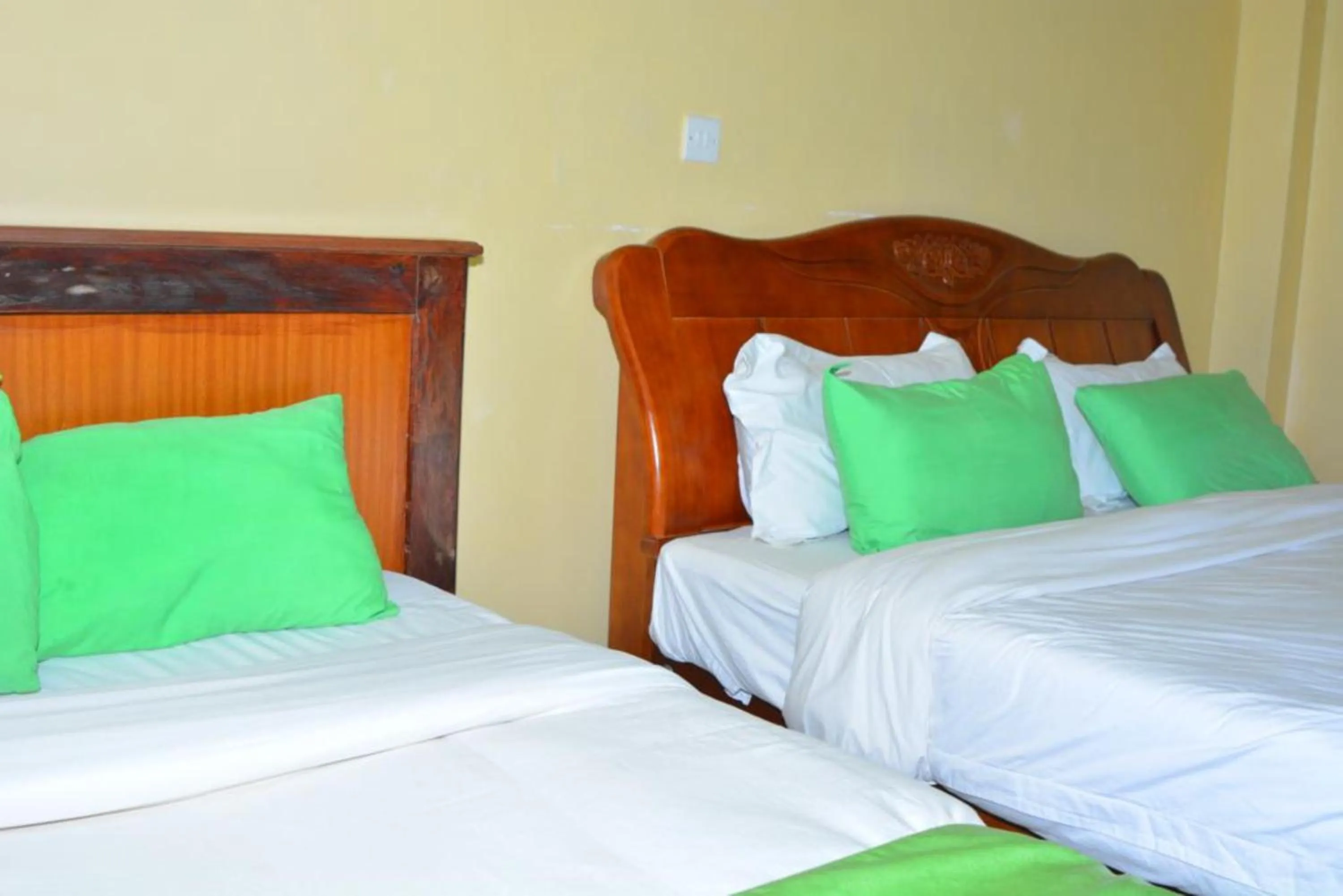 Bedroom in Omega Gardens Hotel