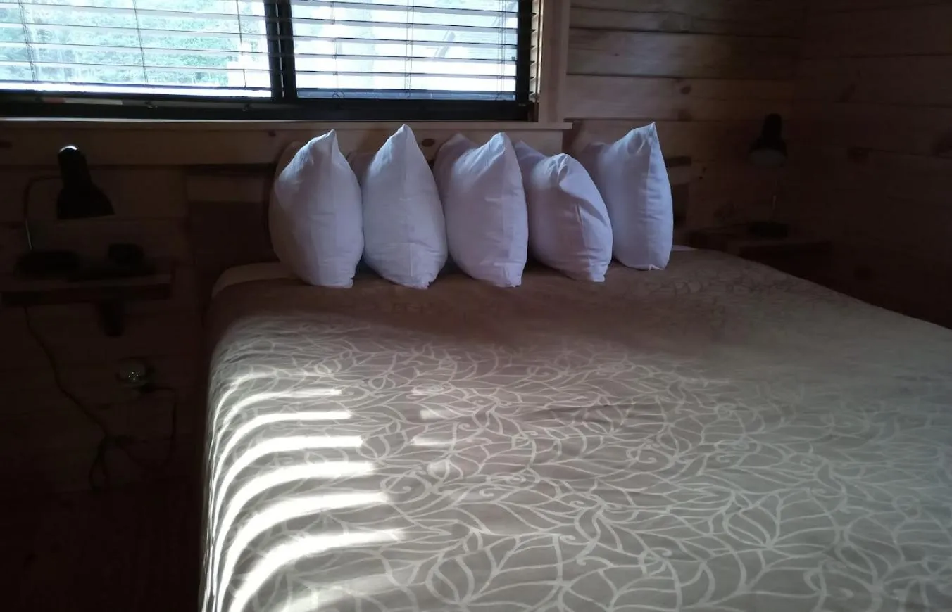 Bed in Beach House Lakeside Cottages
