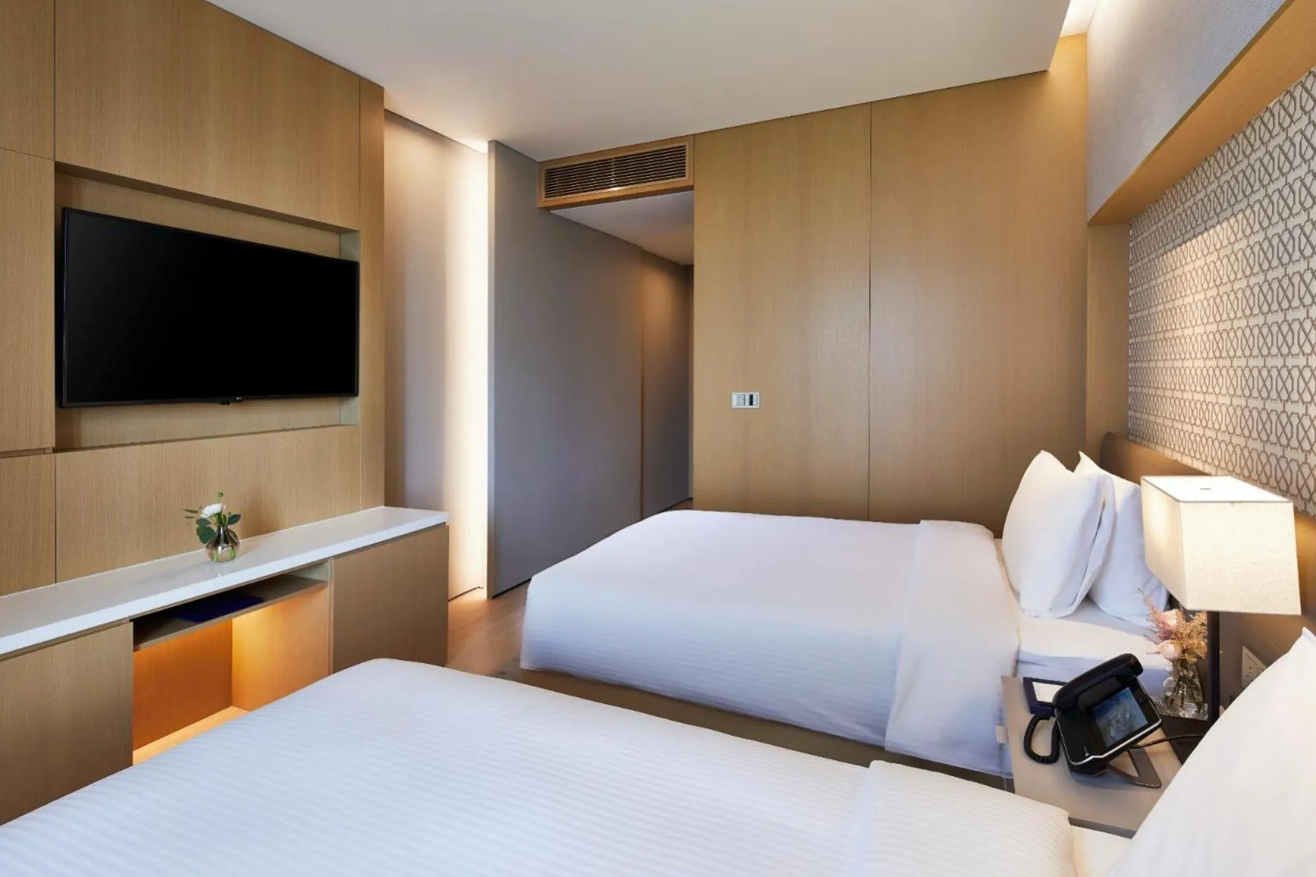 Bed in Shinhwa Jeju Shinhwa World Hotels