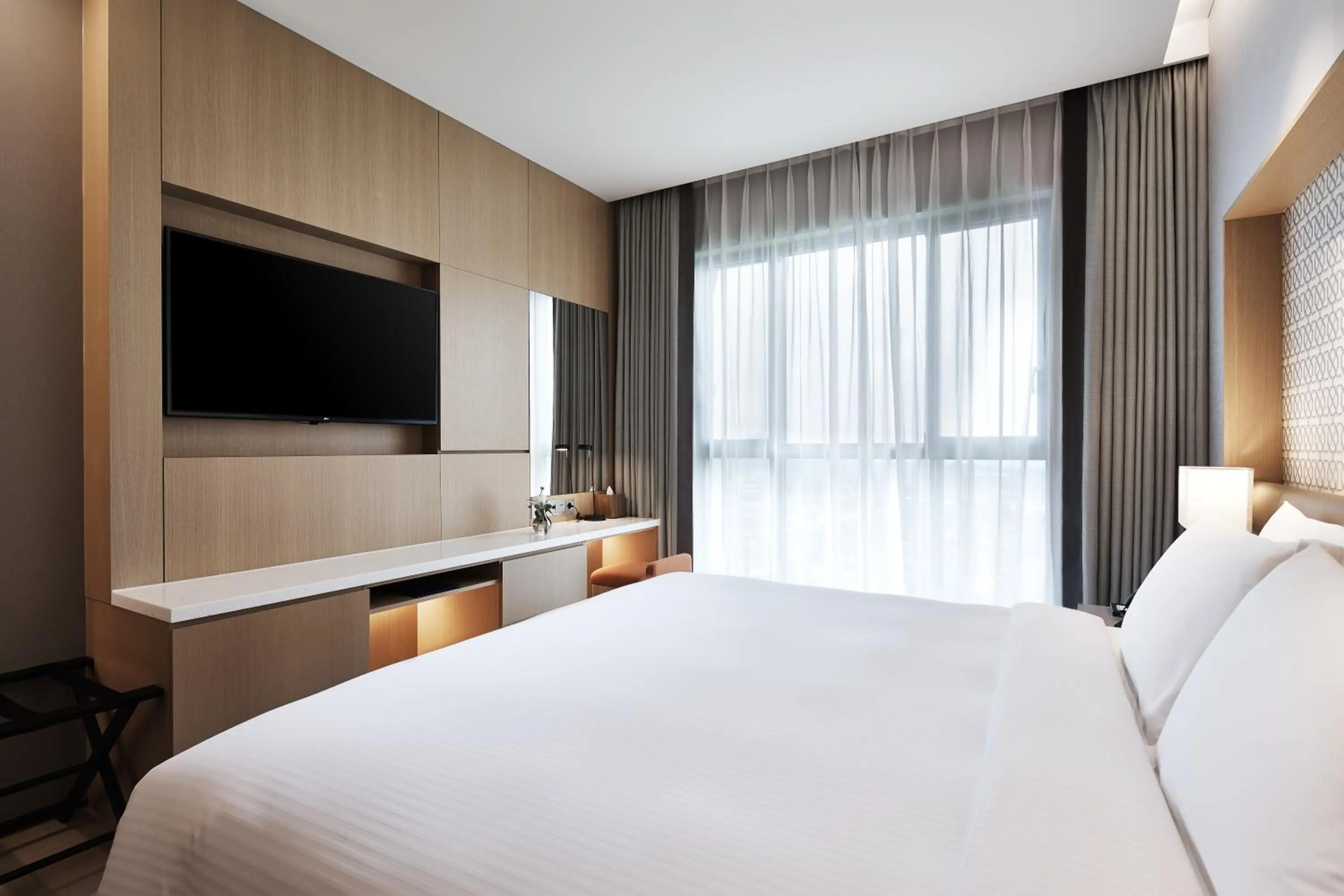 Bed in Shinhwa Jeju Shinhwa World Hotels