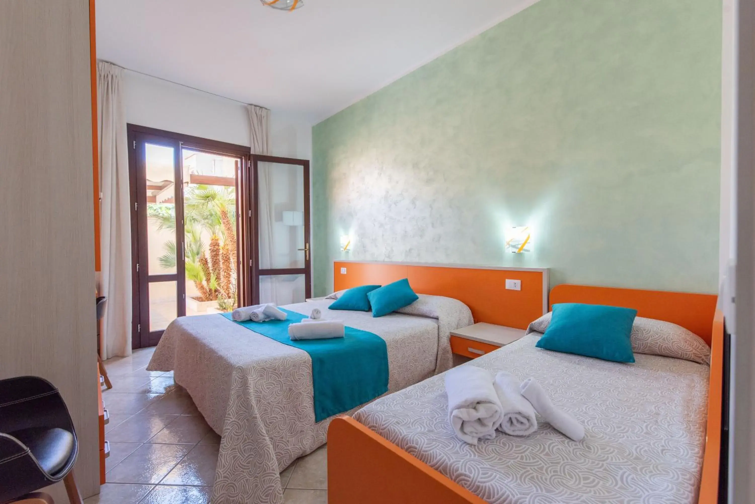 Triple Room with Patio in Affittacamere Aloe Triple Room with Patio in Affittacamere Aloe