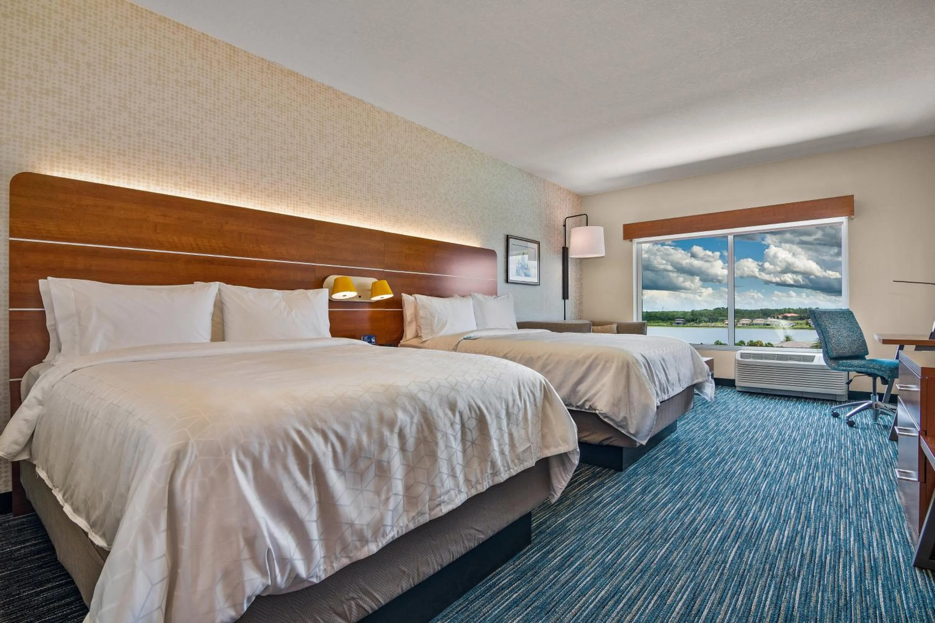 Photo of the whole room, Bed in Holiday Inn Express & Suites Orlando- Lake Buena Vista by IHG
