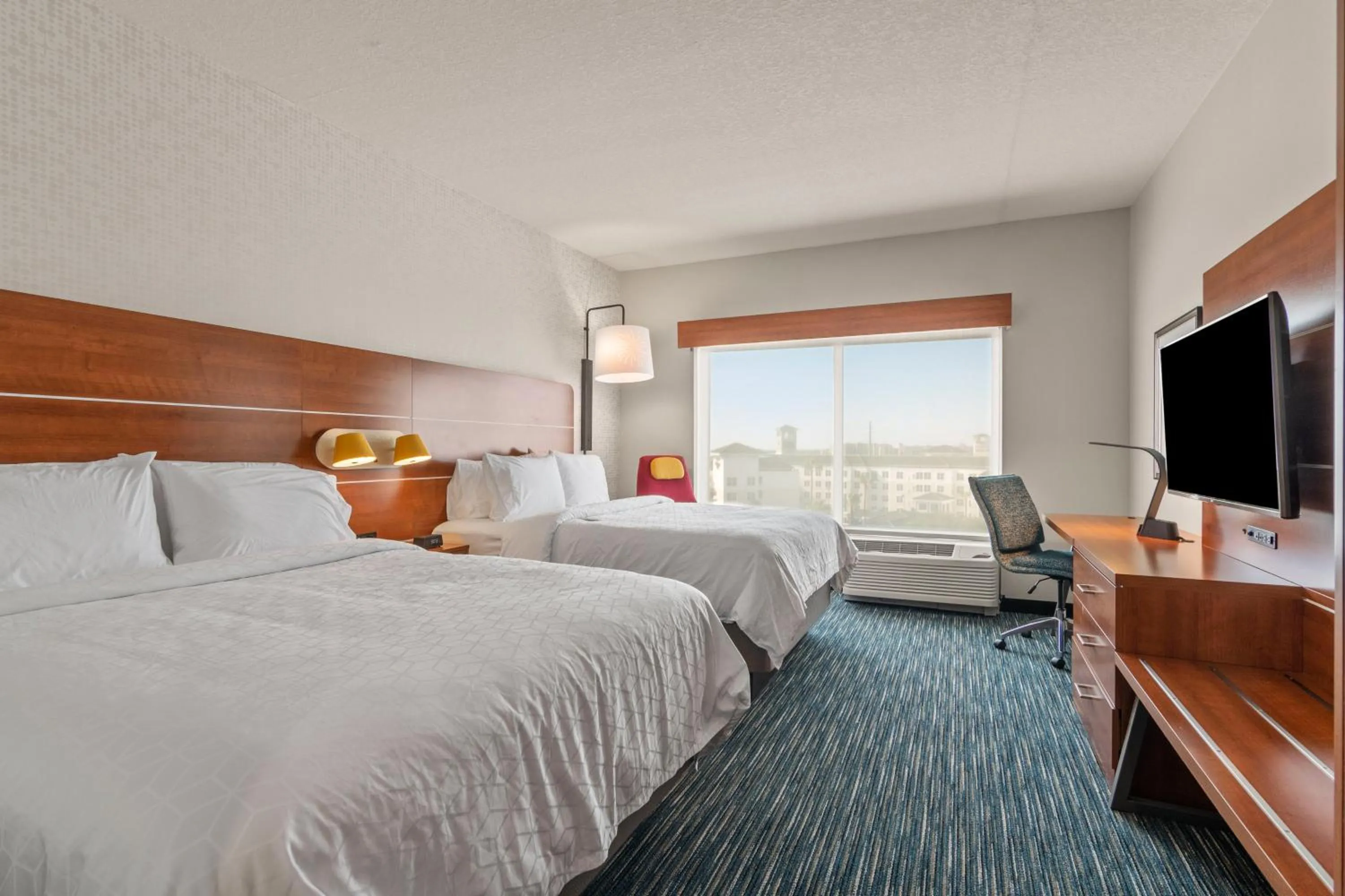 Photo of the whole room, Bed in Holiday Inn Express & Suites Orlando- Lake Buena Vista by IHG