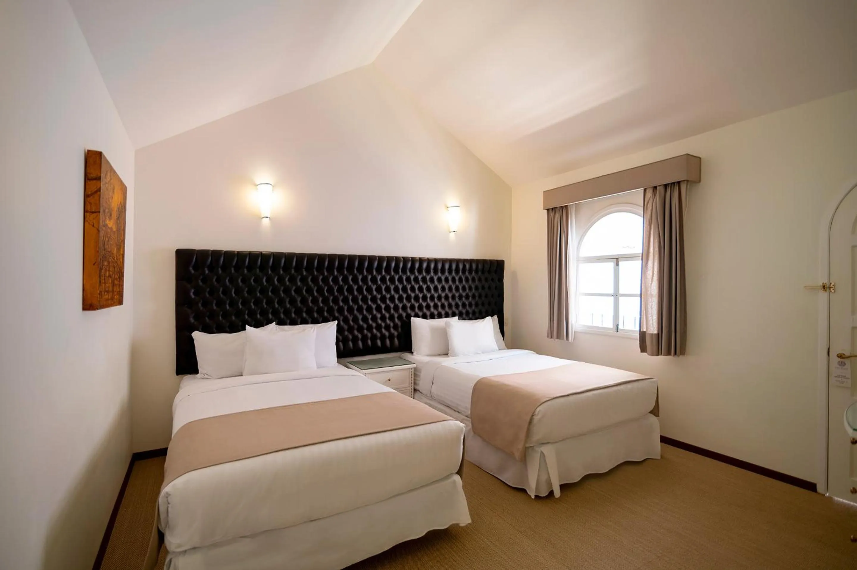 Bed in Casa Bonita Hotel & Luxury Residence