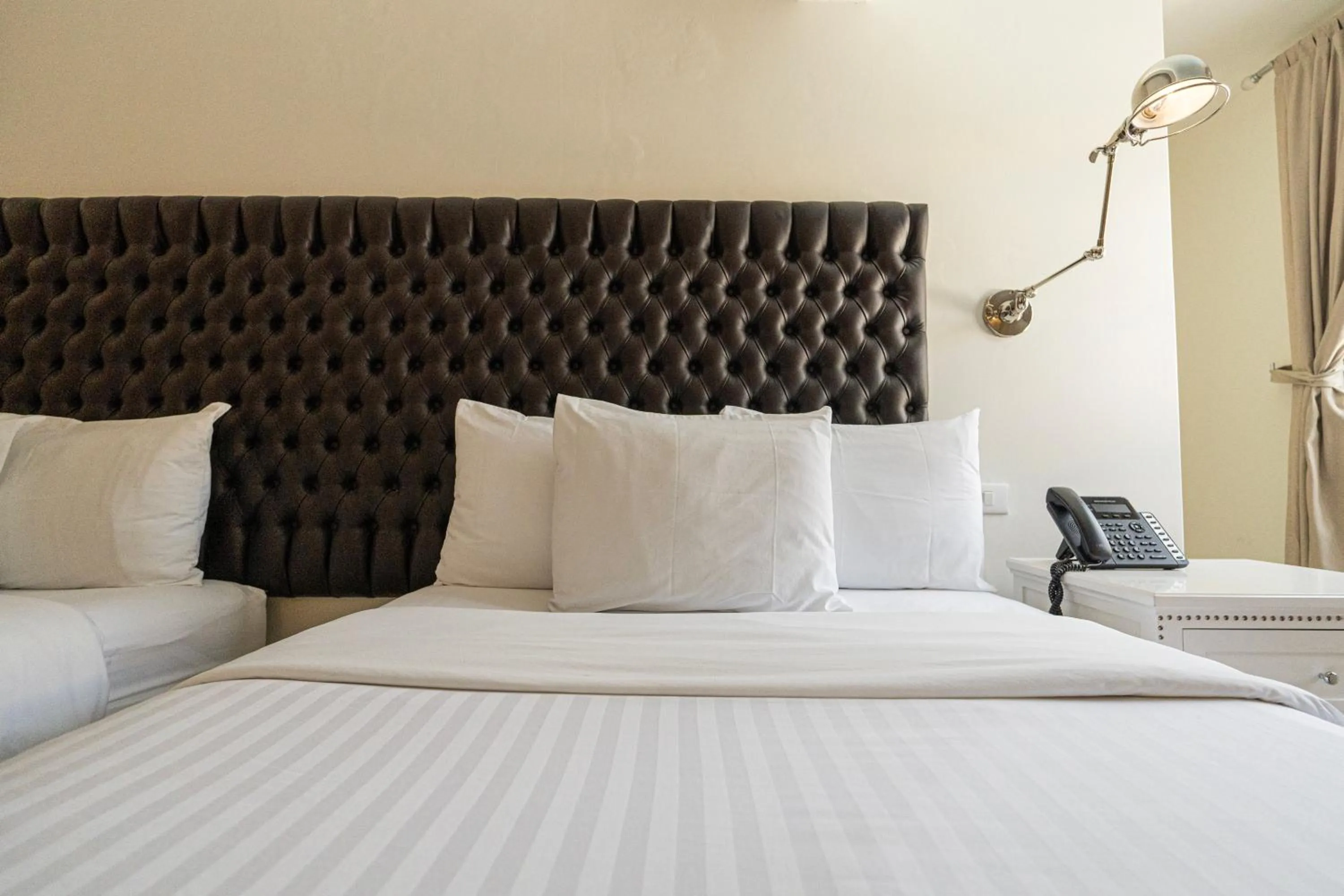 Bed in Casa Bonita Hotel & Luxury Residence