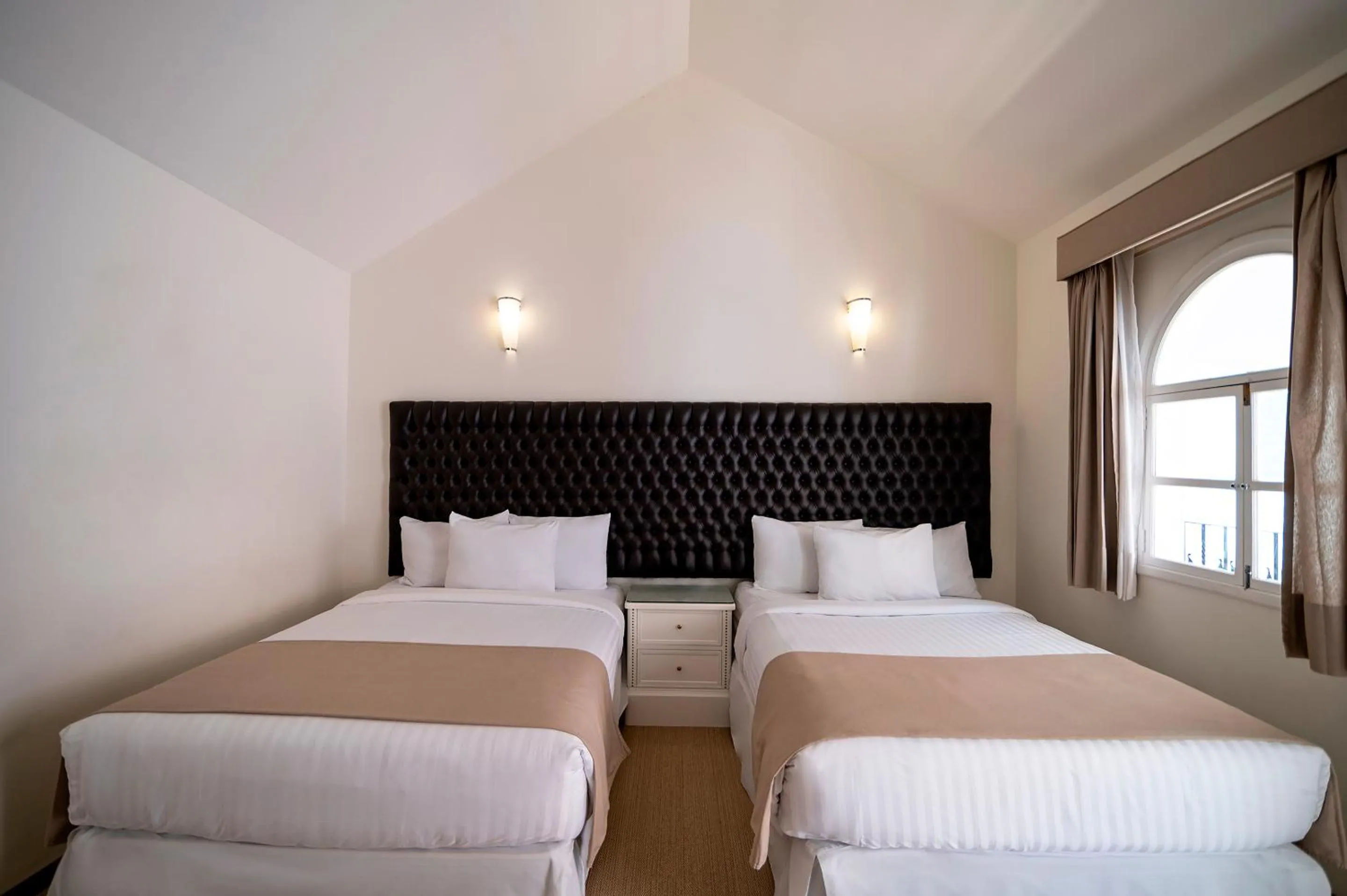 Bed in Casa Bonita Hotel & Luxury Residence