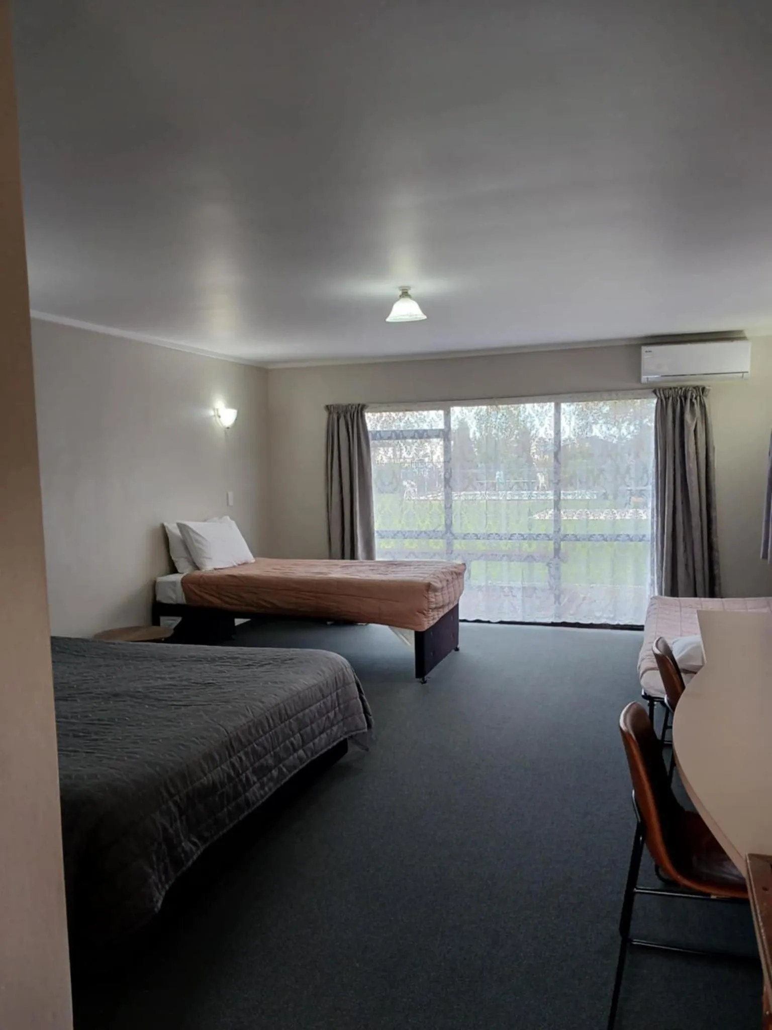 Bed in Ambassador Motel