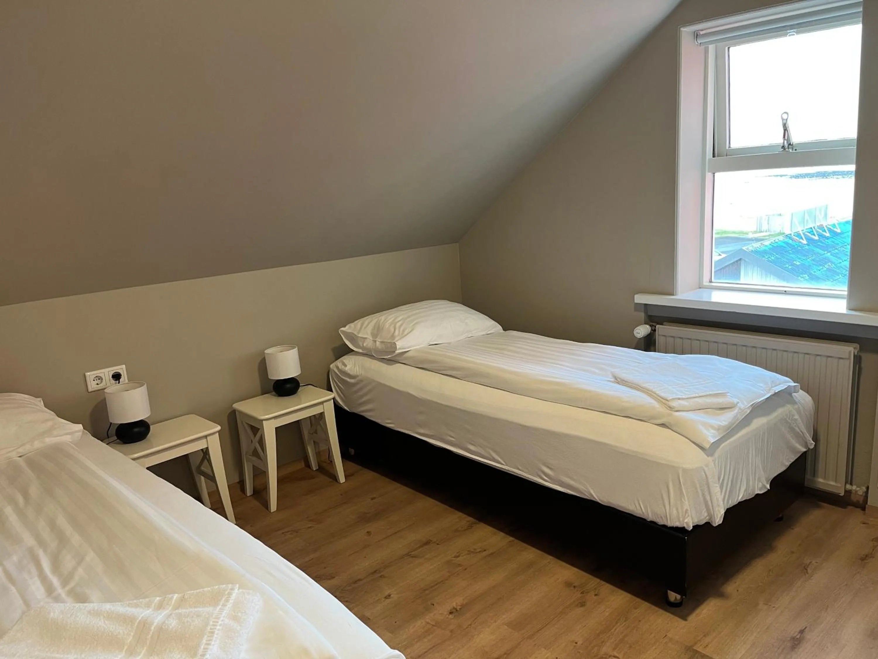 Bedroom, Bed in Hvammur Apartments by the Harbour