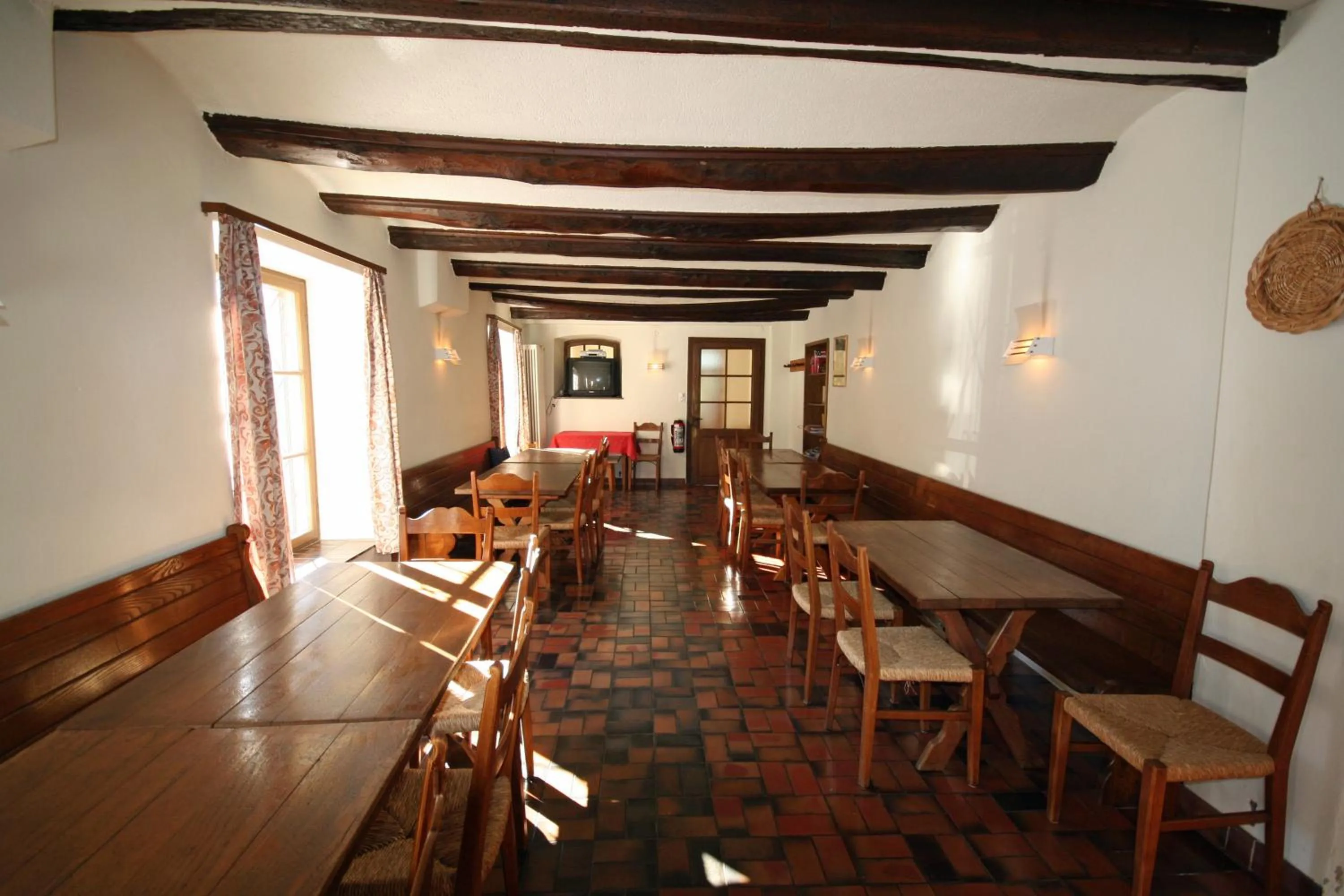 Communal lounge/ TV room in Lugano Savosa Youth Hostel