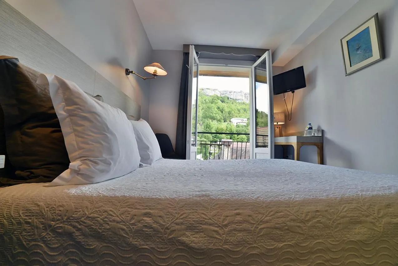 Photo of the whole room, Bed in Hôtel de France