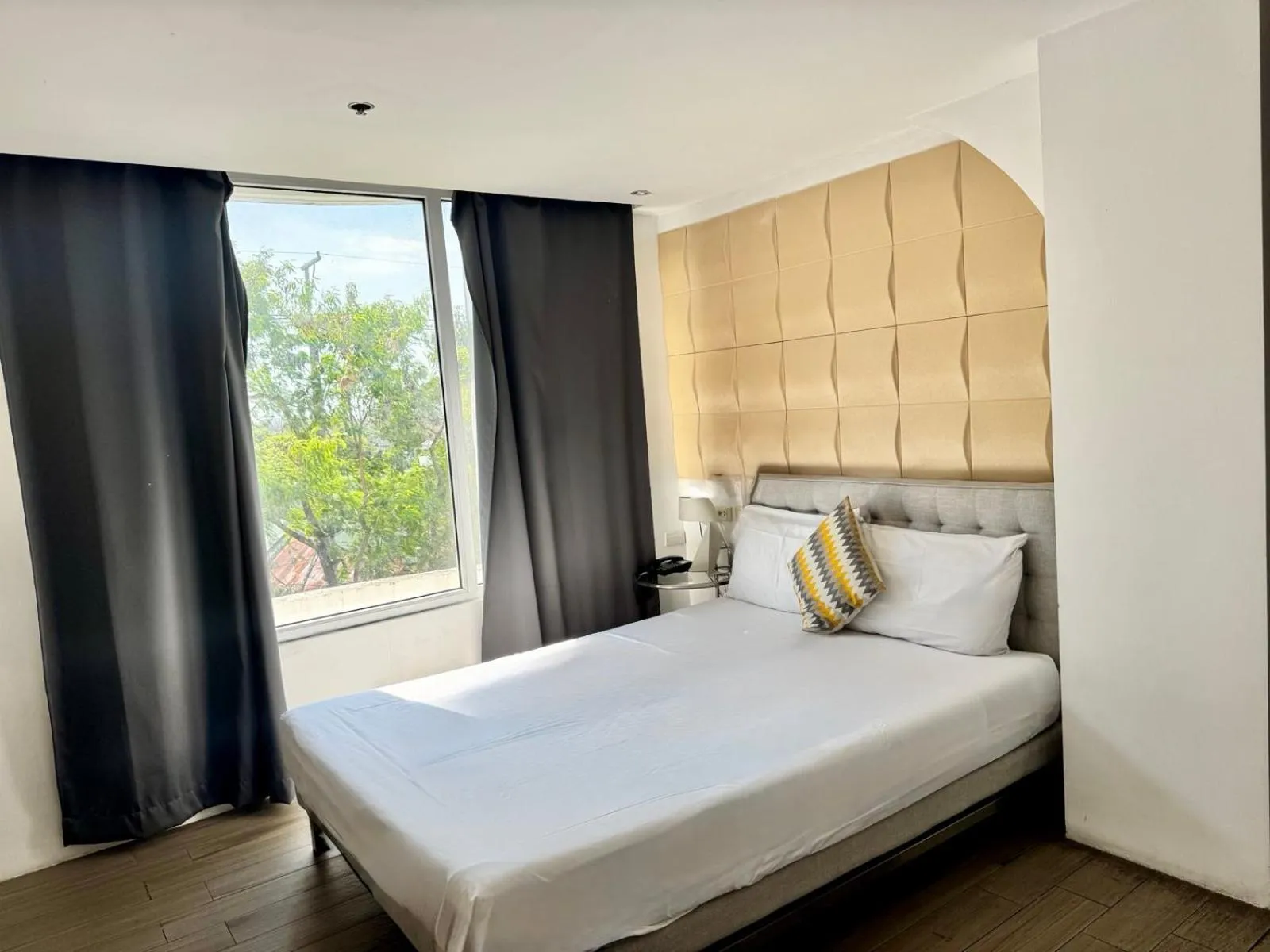Bed in City Park Hotel Residences