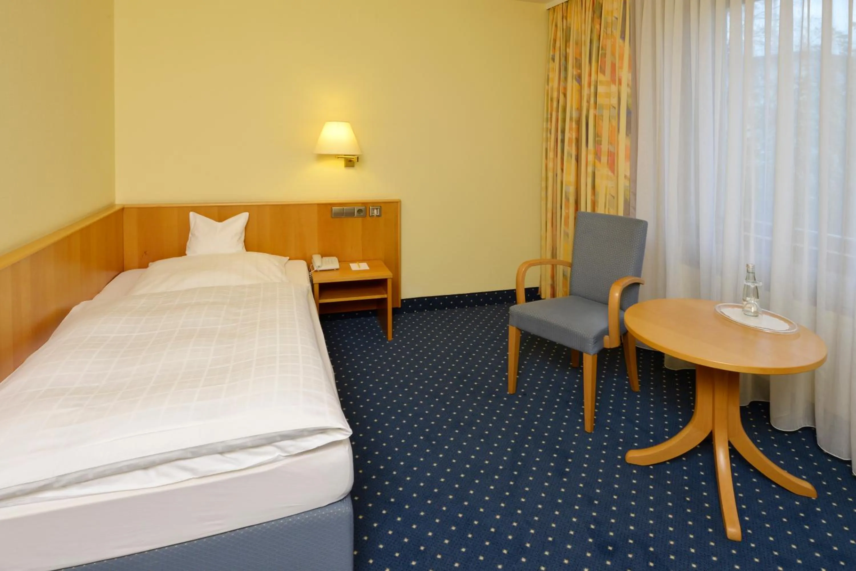 Seating area, Bed in Hotel Sonne Eintracht KG Achern