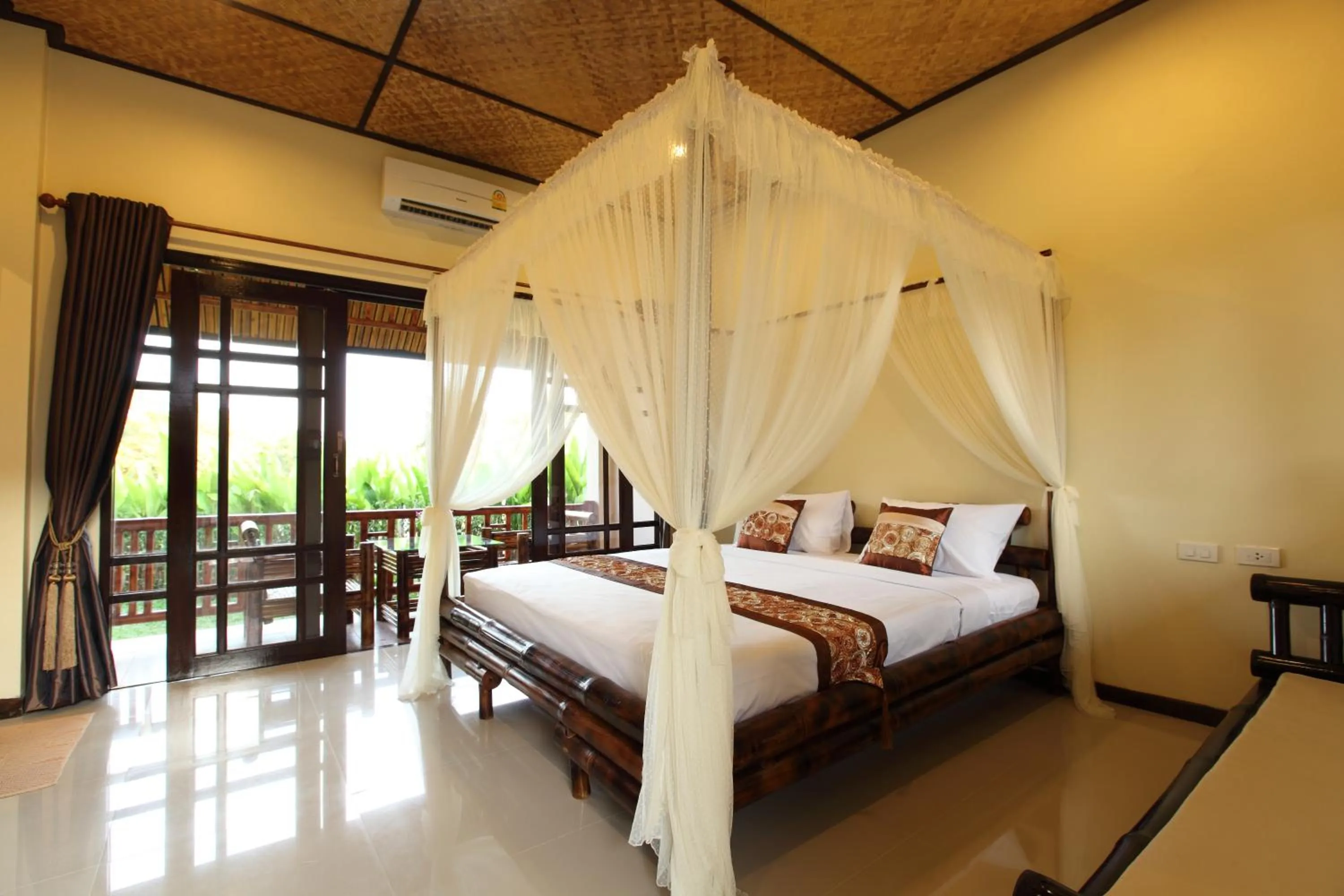 Bed in Starwell Bali Resort