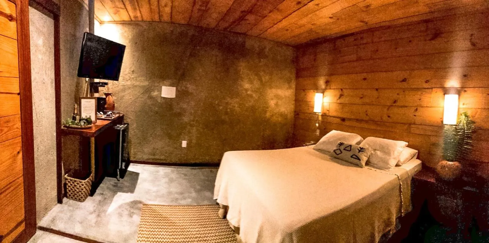 Bedroom in Aloha Village Bangalôs