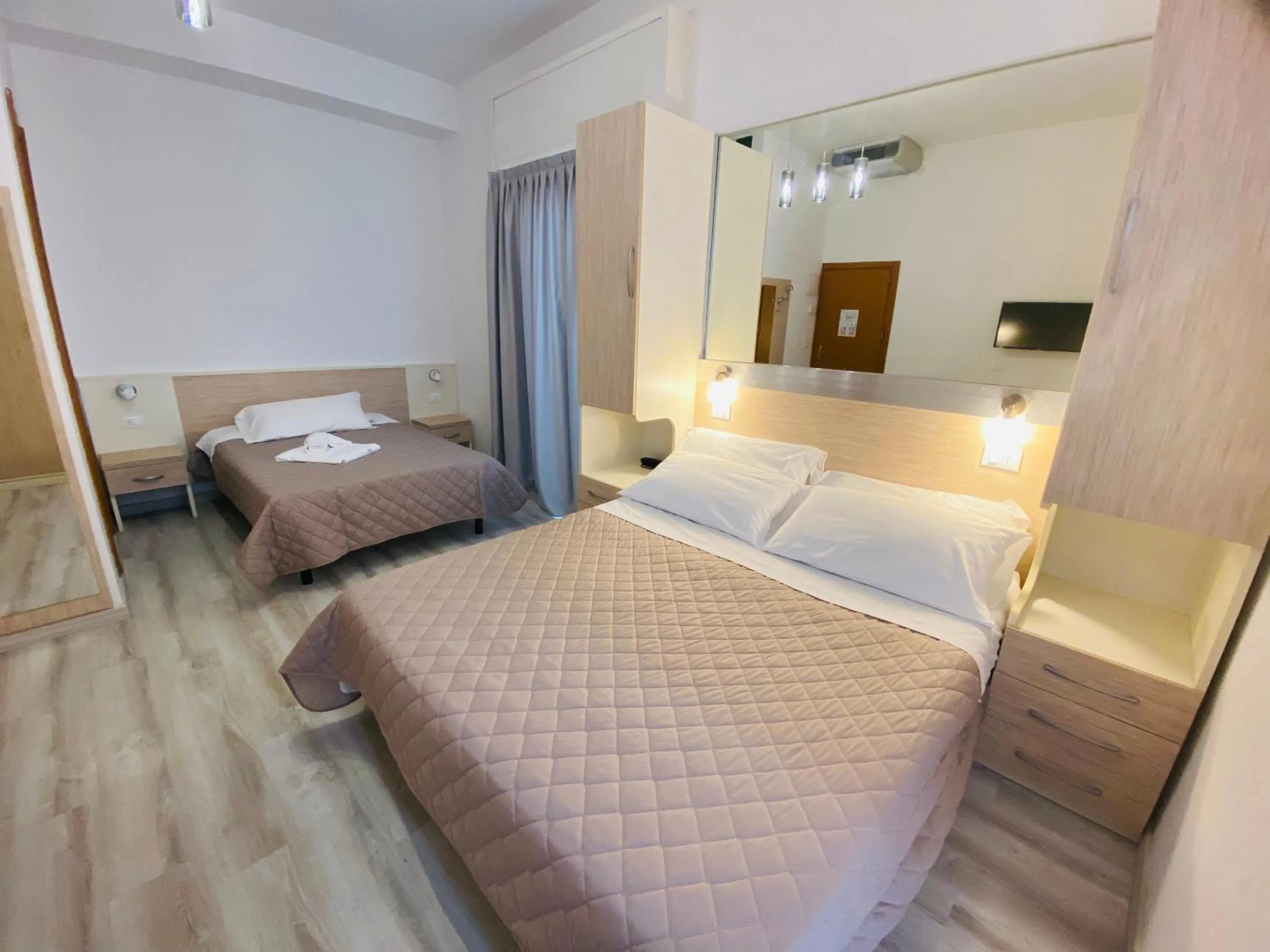 Bed in Hotel Butterfly Wellness & Spa