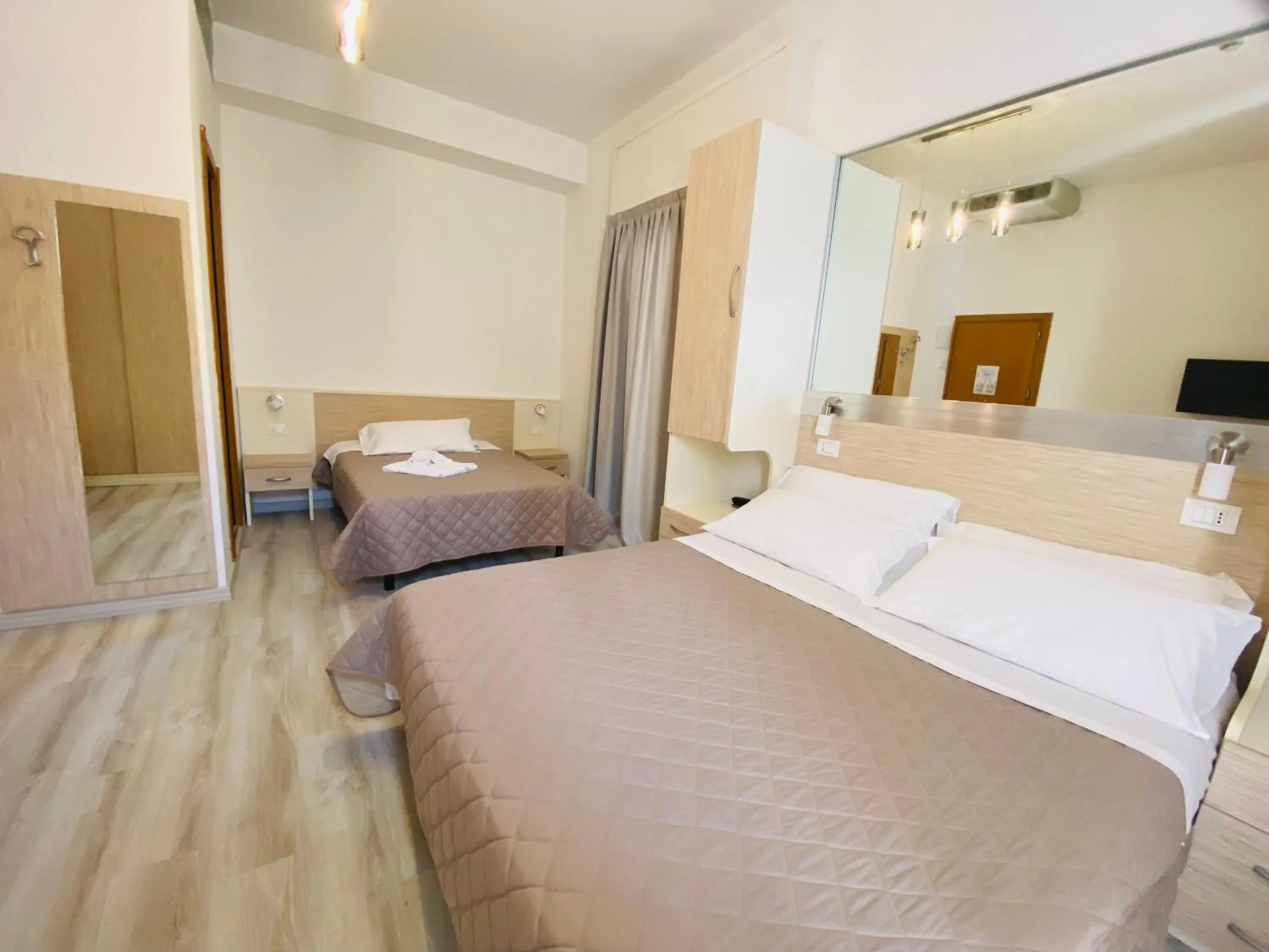 Bed in Hotel Butterfly Wellness & Spa