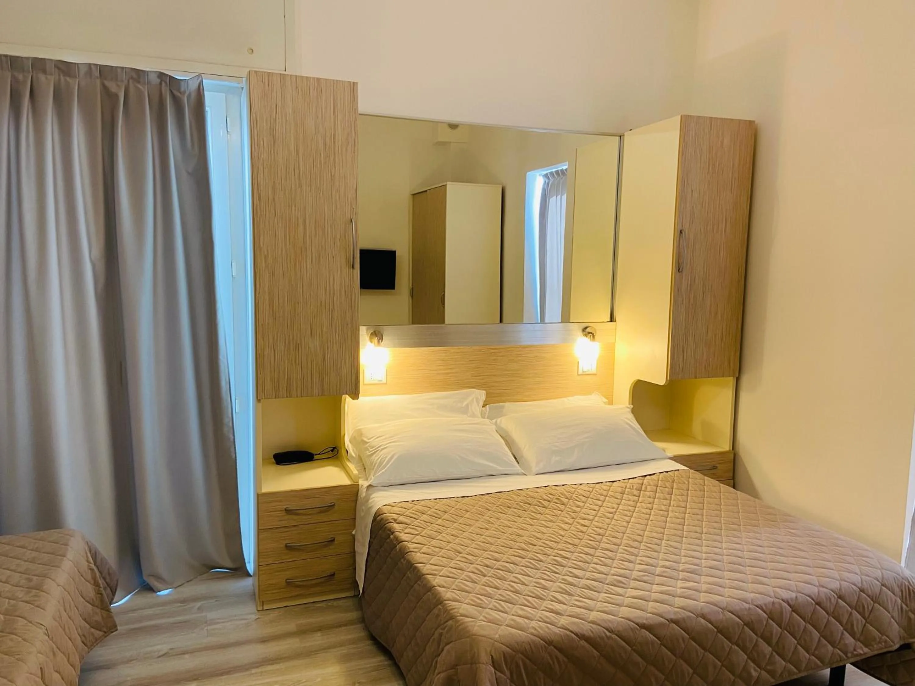 Bed in Hotel Butterfly Wellness & Spa