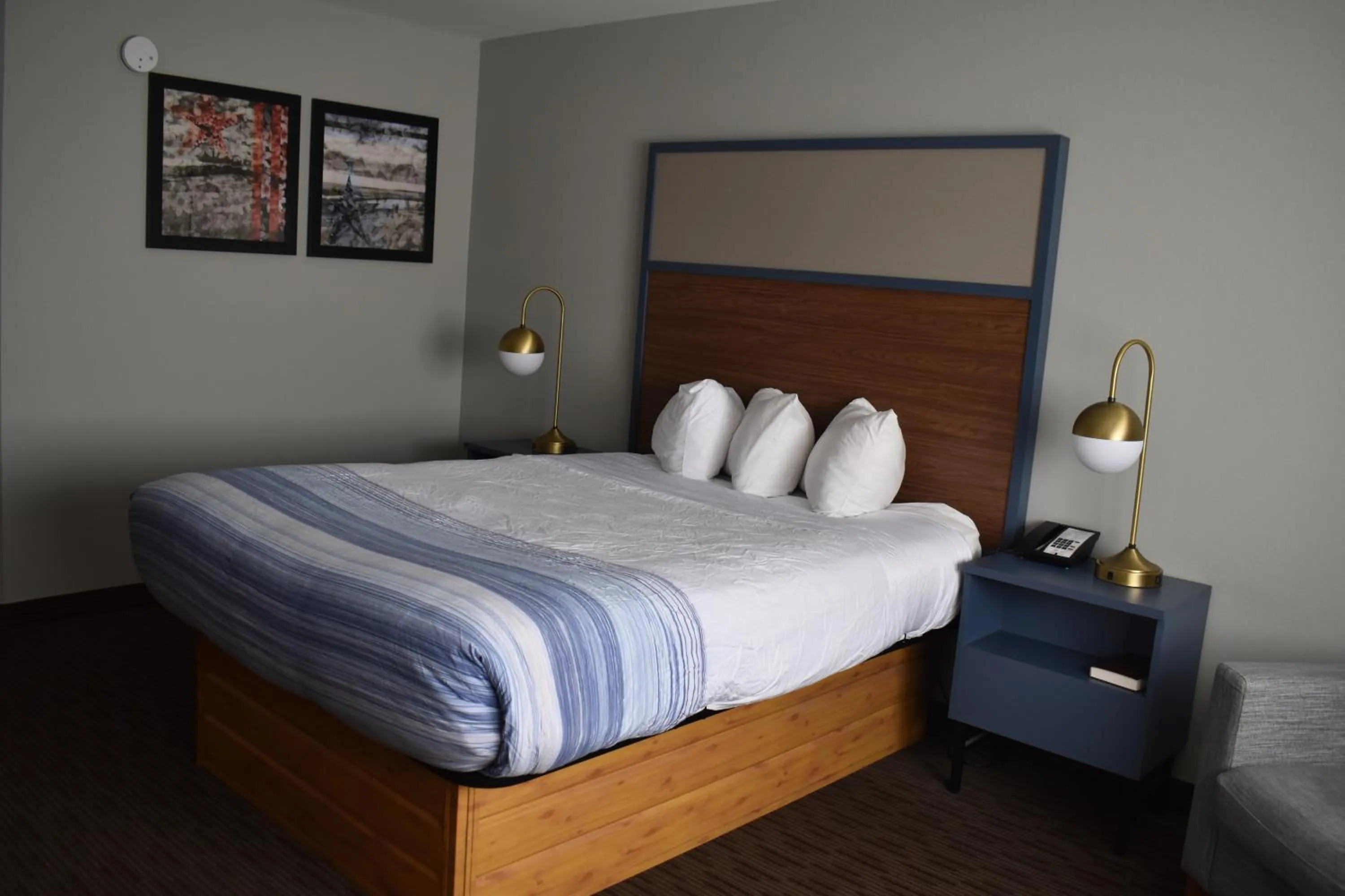 Bed in AmericInn by Wyndham Sioux City