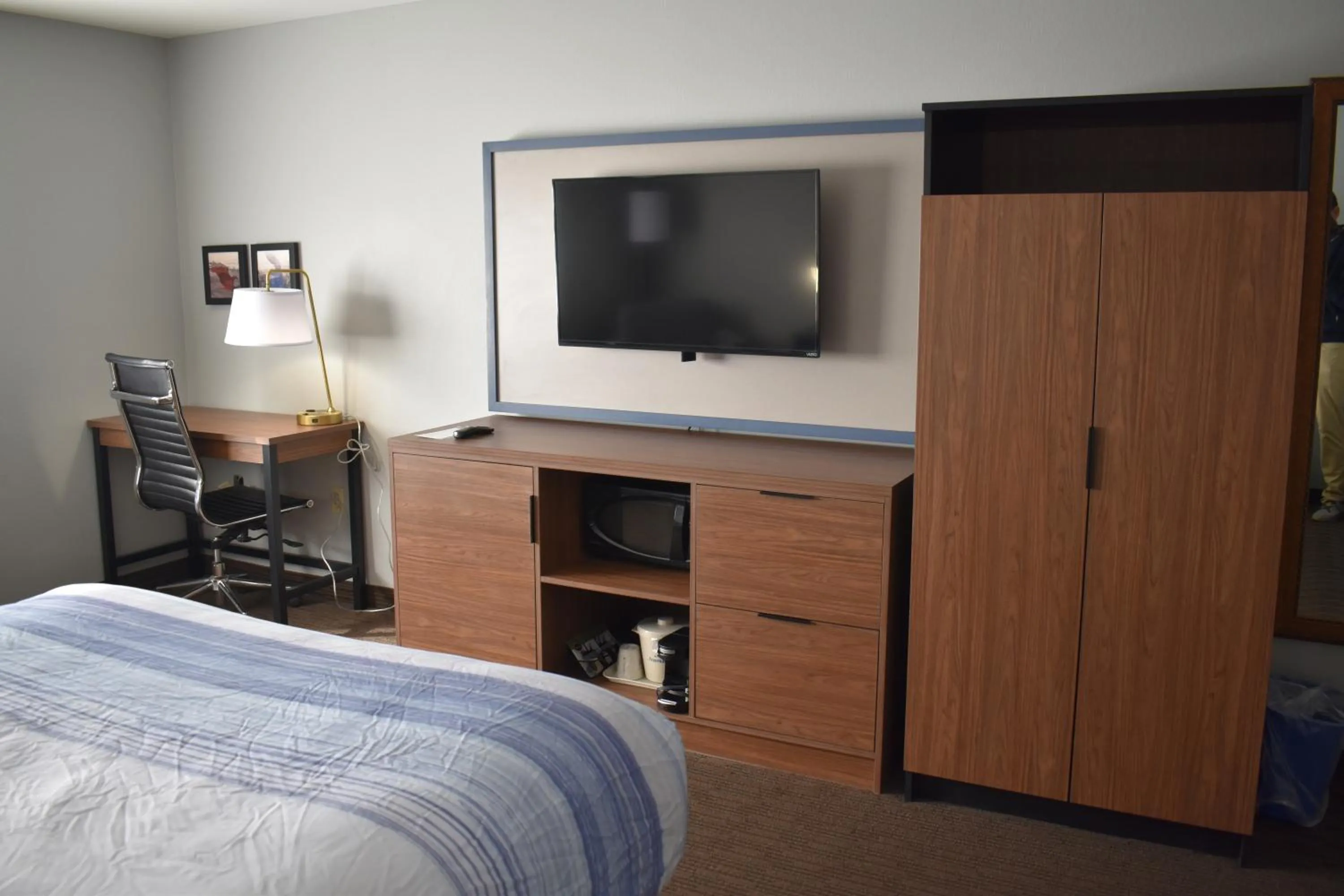 Bed in AmericInn by Wyndham Sioux City