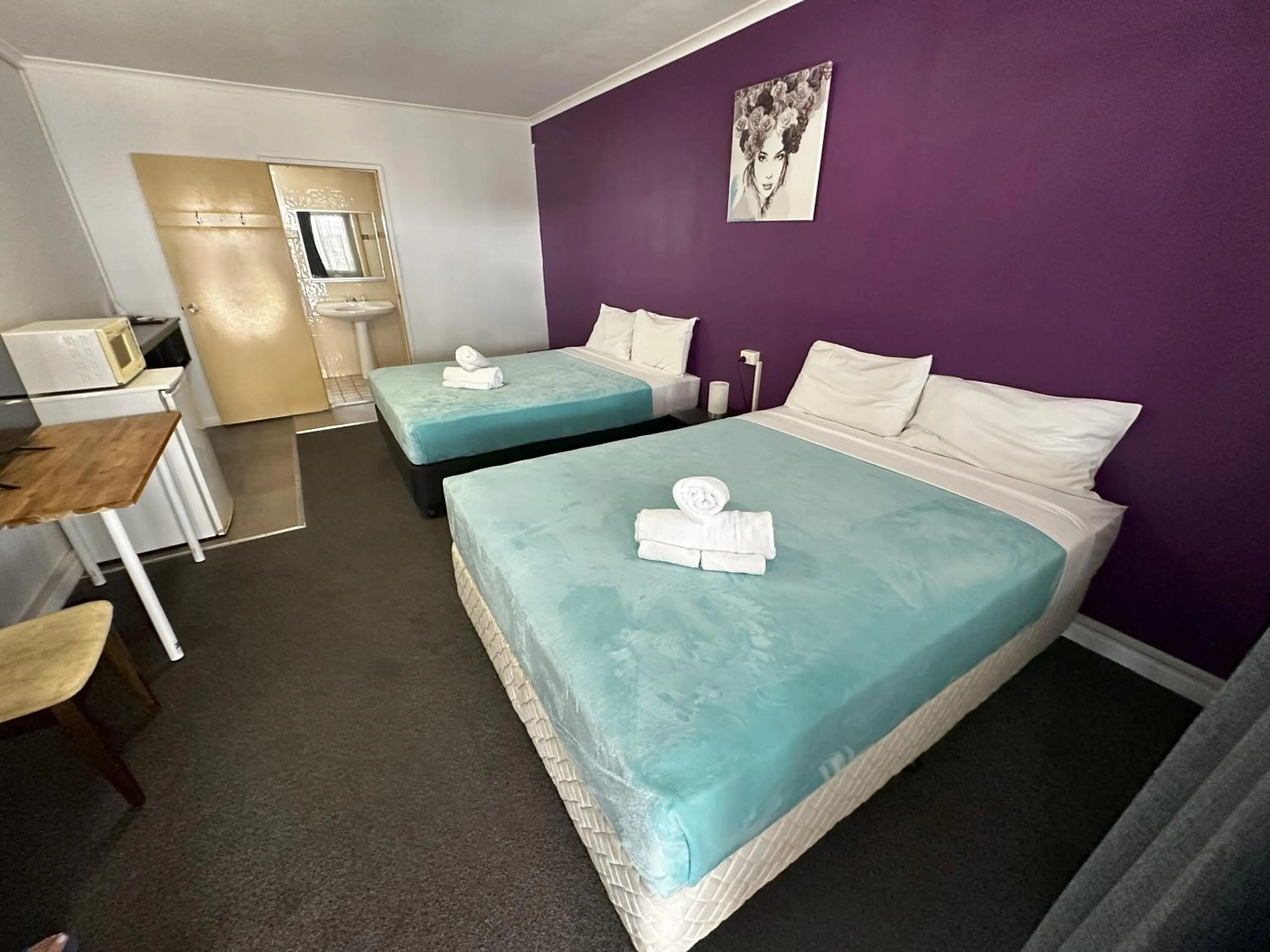 Bed in The Q Motel Rockhampton