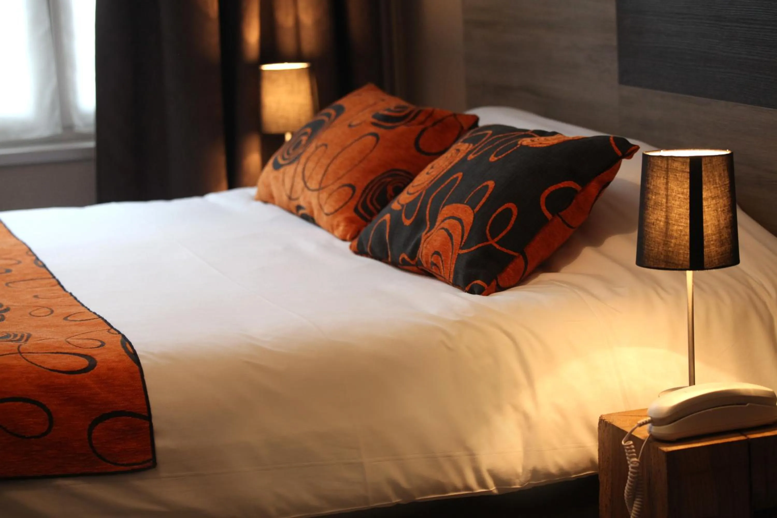 Bed in Logis Hostellerie de l'Abbaye