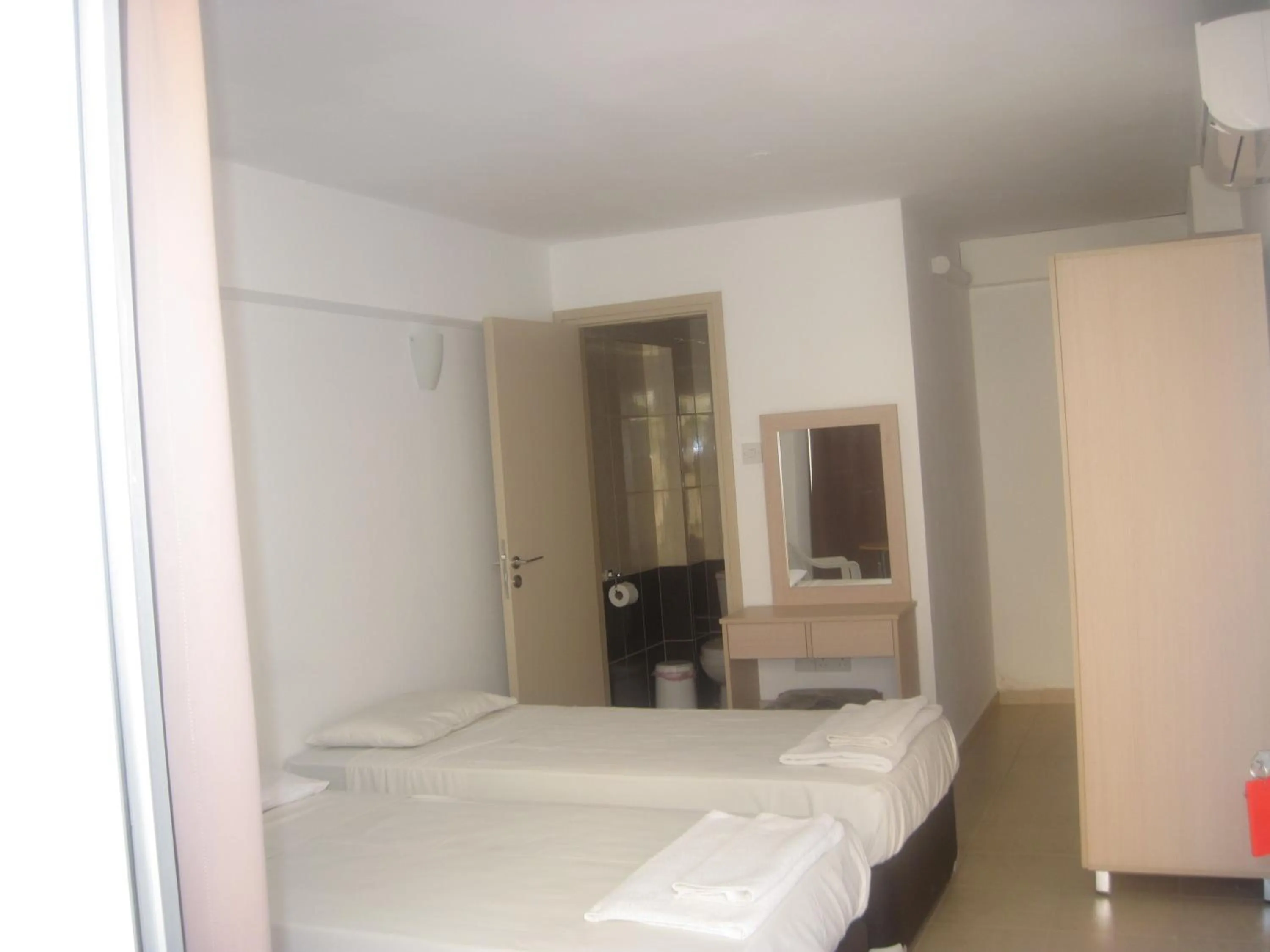 Seating area, Bed in A Maos Hotel Apartments