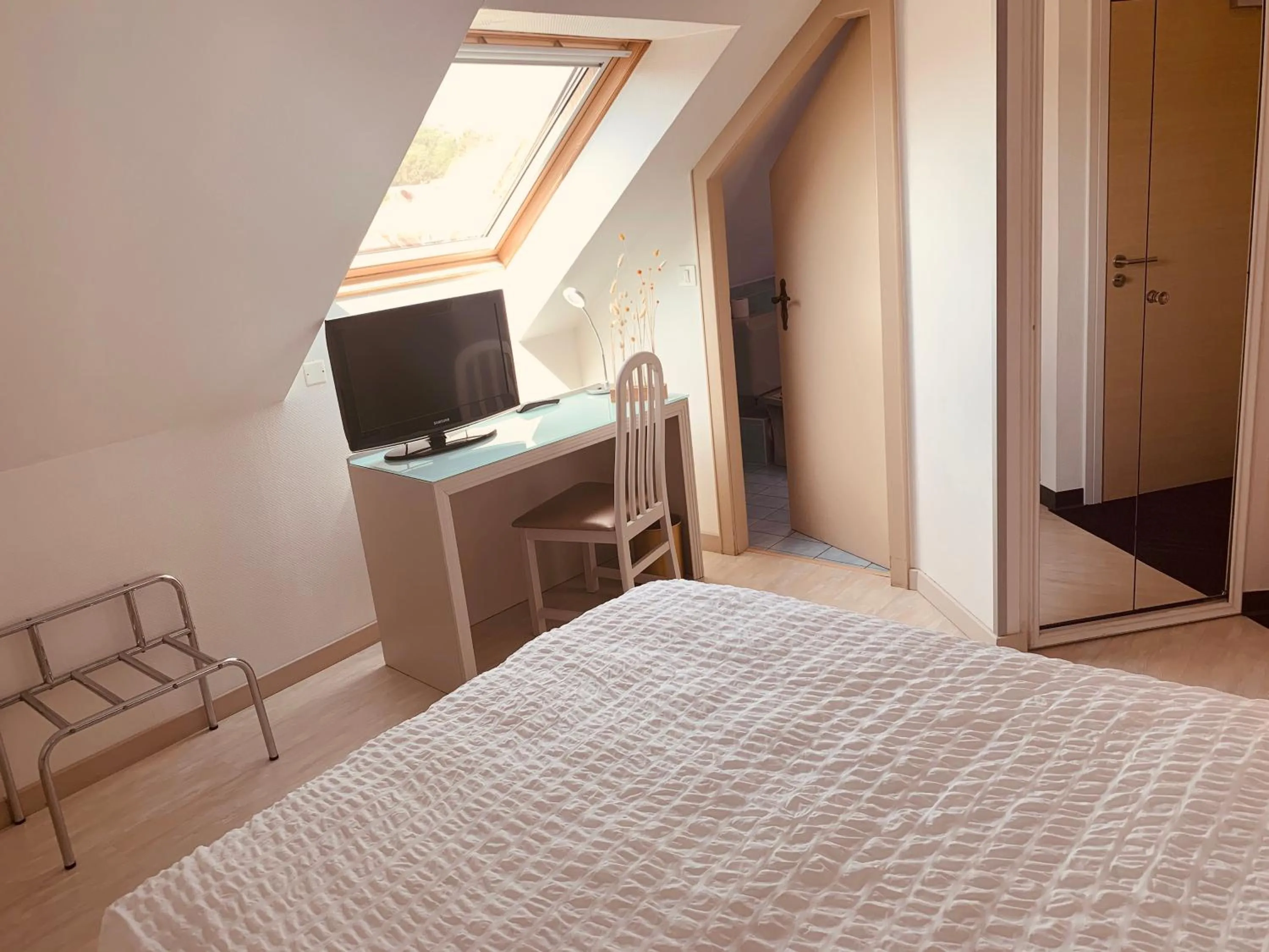 Photo of the whole room, Bed in Logis Hôtel Restaurant Au Lion Rouge