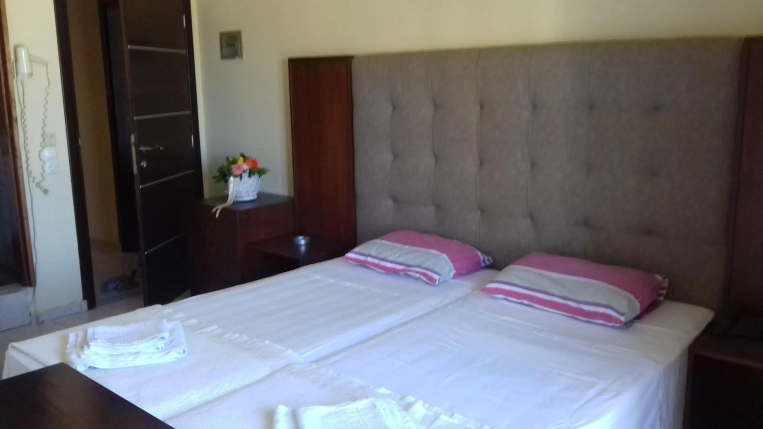 Bed in Parthenon Hotel