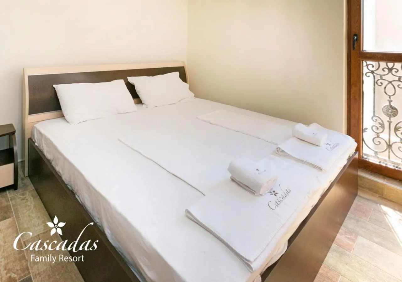 Bed in Cascadas Family Resort